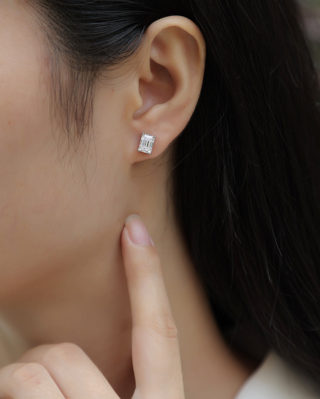 Enthralled Emerald-Cut Moissanite Stud Earrings in Sterling Silver