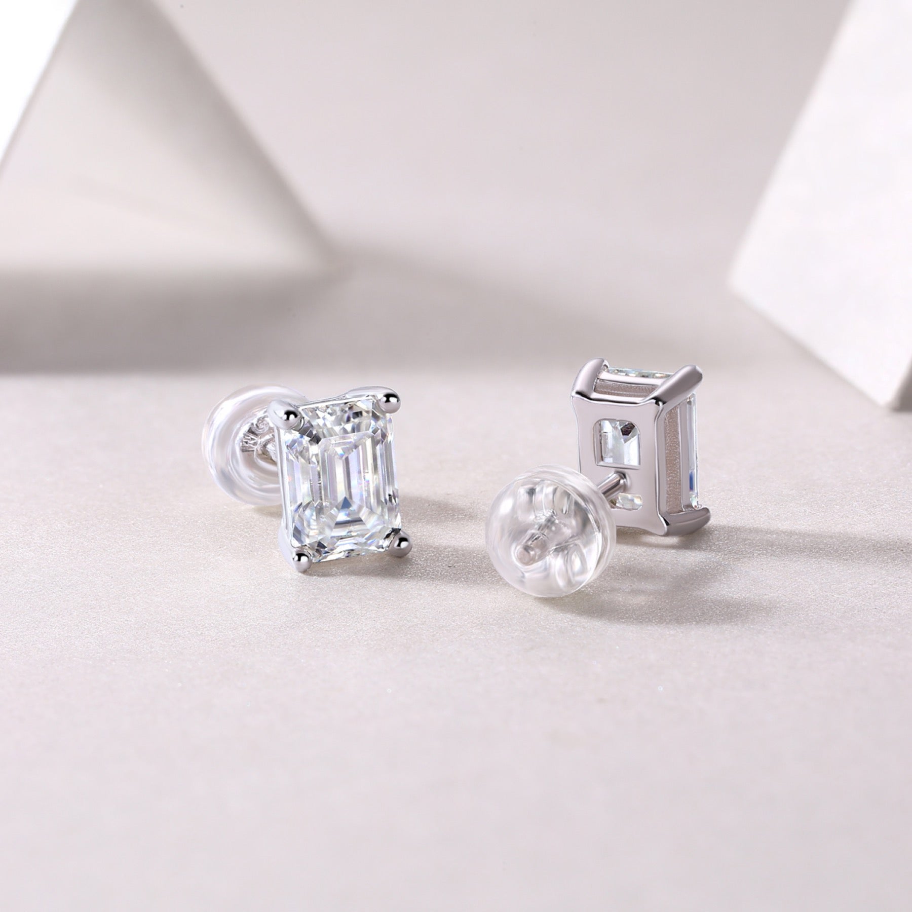 Enthralled Emerald-Cut Moissanite Stud Earrings in Sterling Silver