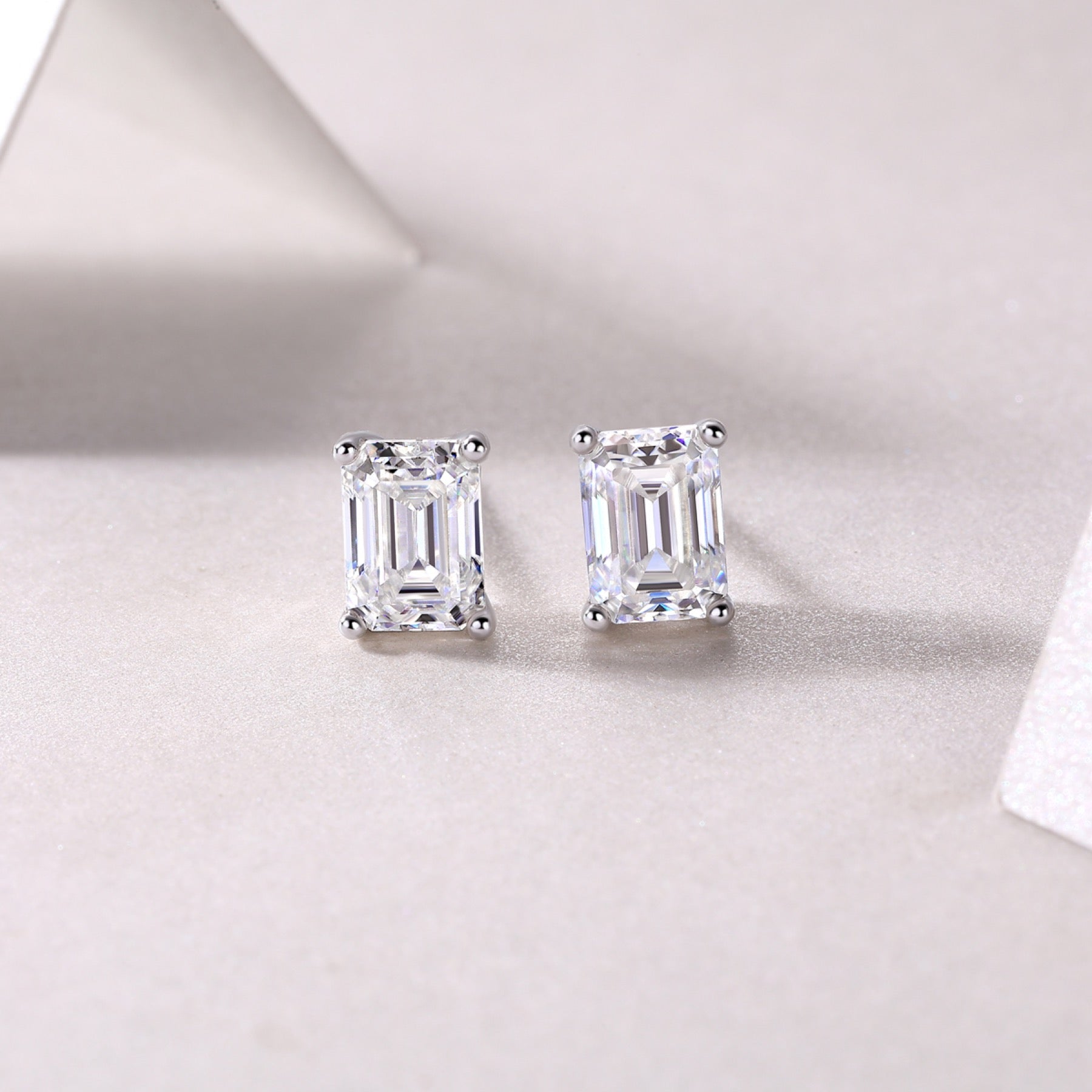 Enthralled Emerald-Cut Moissanite Stud Earrings in Sterling Silver