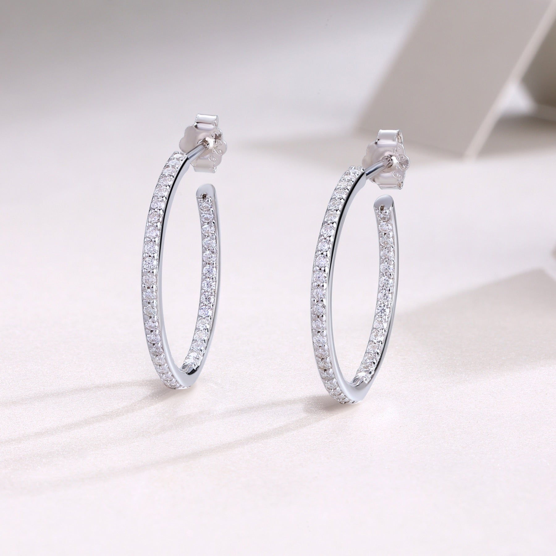 Ribbon Moissanite Hoop Earrings in Sterling Silver
