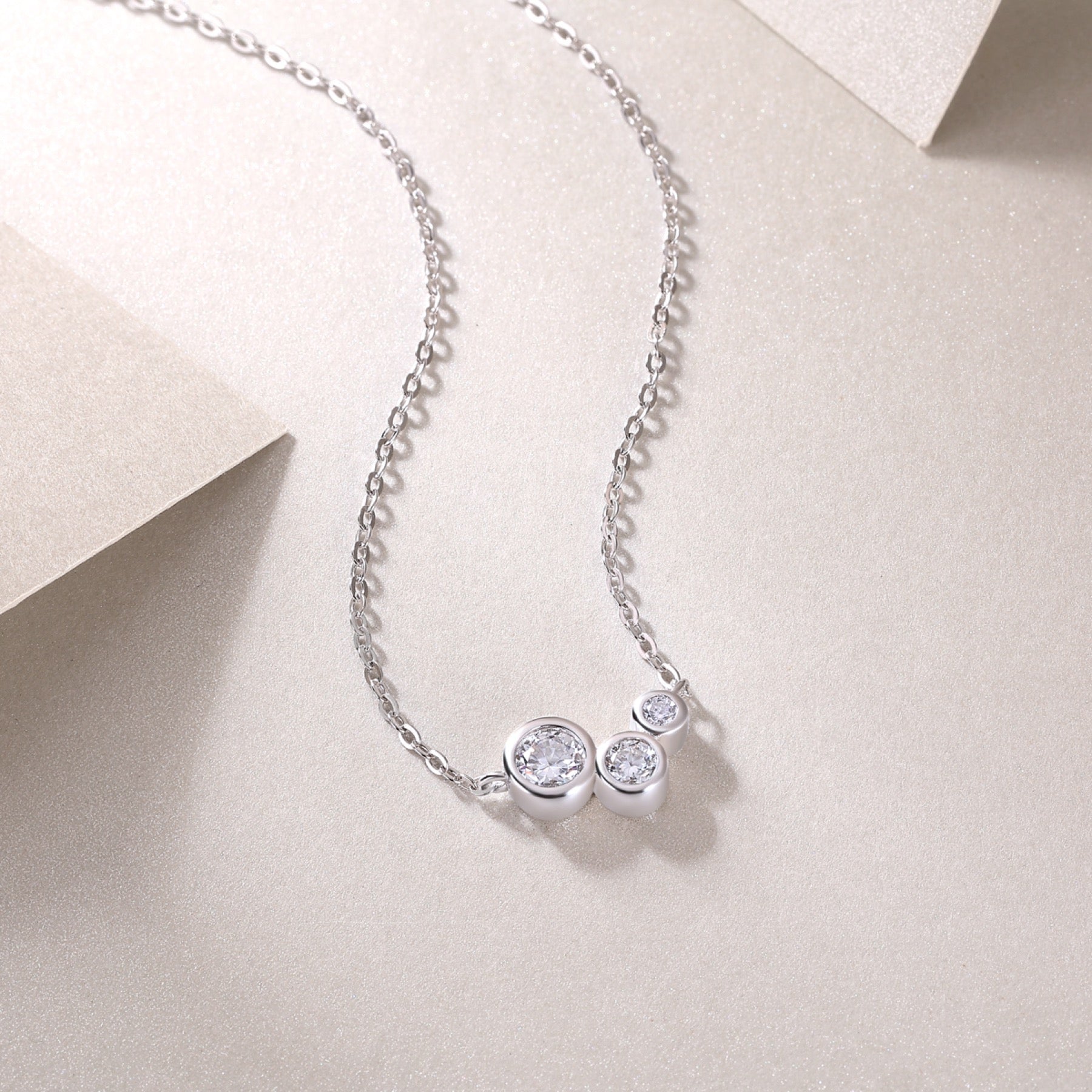 Dewfall Moissanite Three-Stone Necklace in Sterling Silver