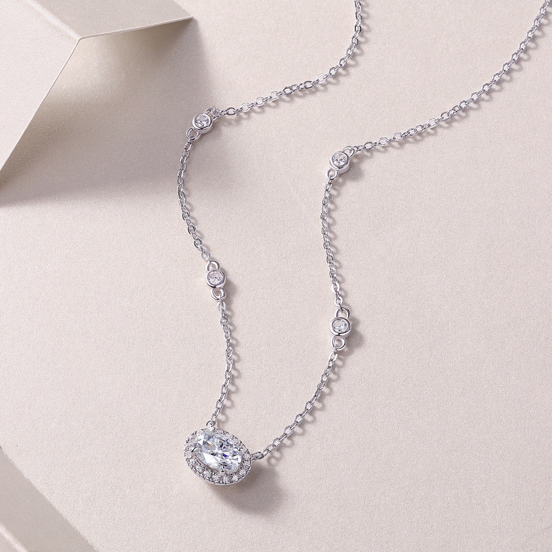 Midsummer Oval-Cut Moissanite Bezel Pendant Necklace in Sterling Silver