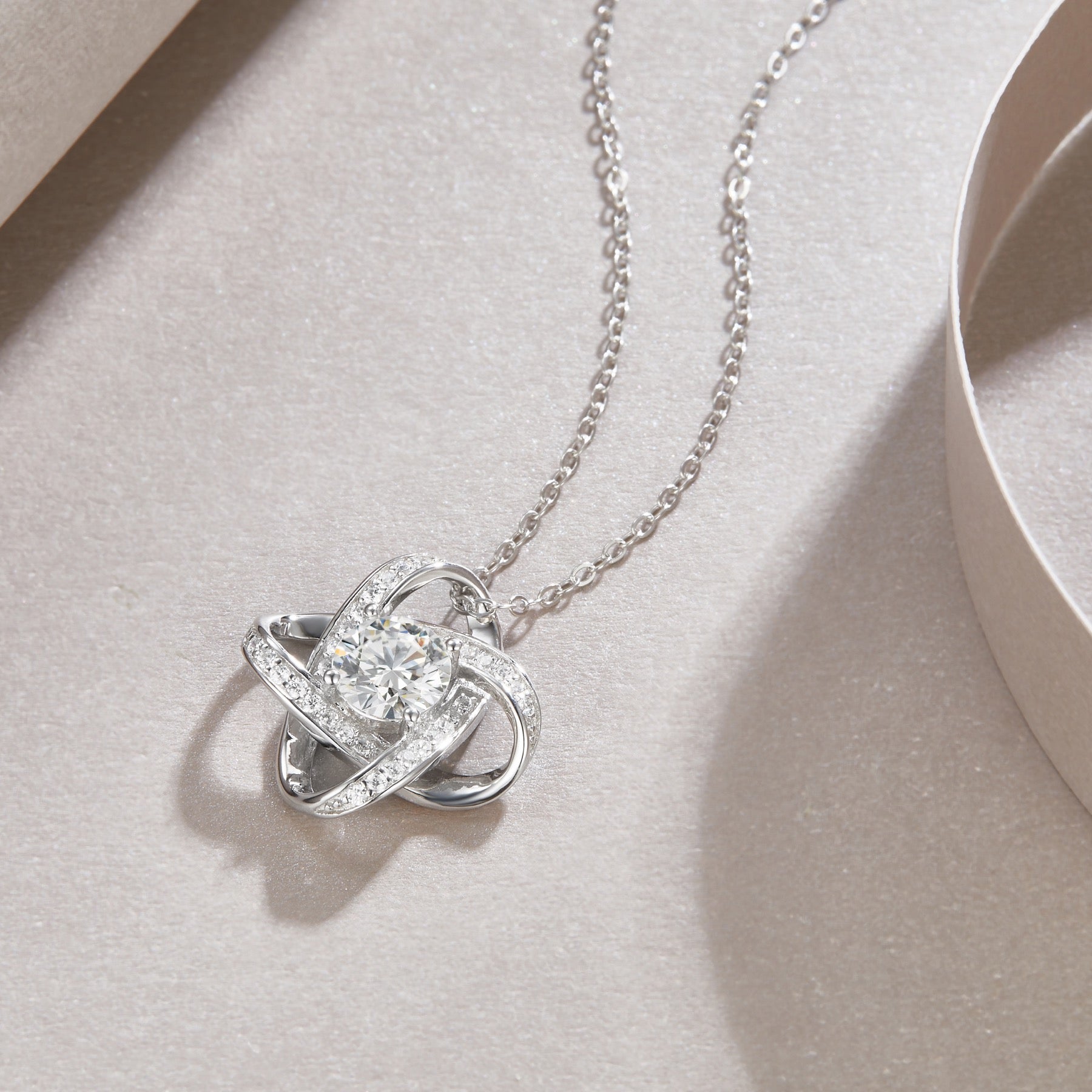Entwined 1 Carat Moissanite Love Knot Pendant Necklace in Sterling Silver