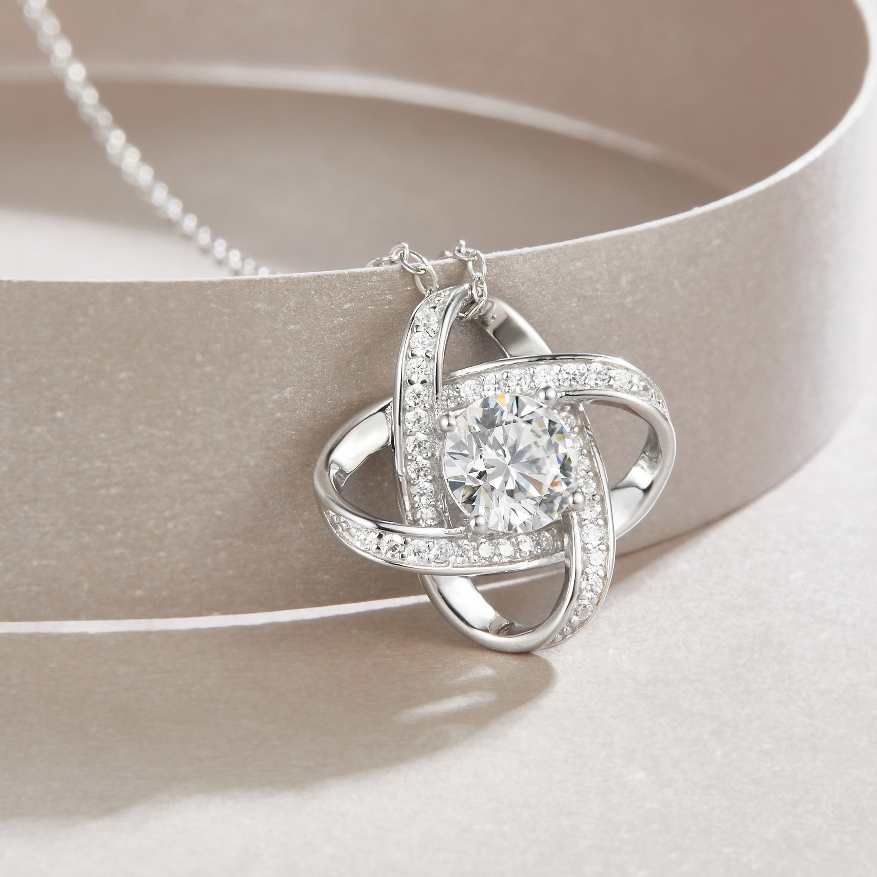 Entwined 1 Carat Moissanite Love Knot Pendant Necklace in Sterling Silver