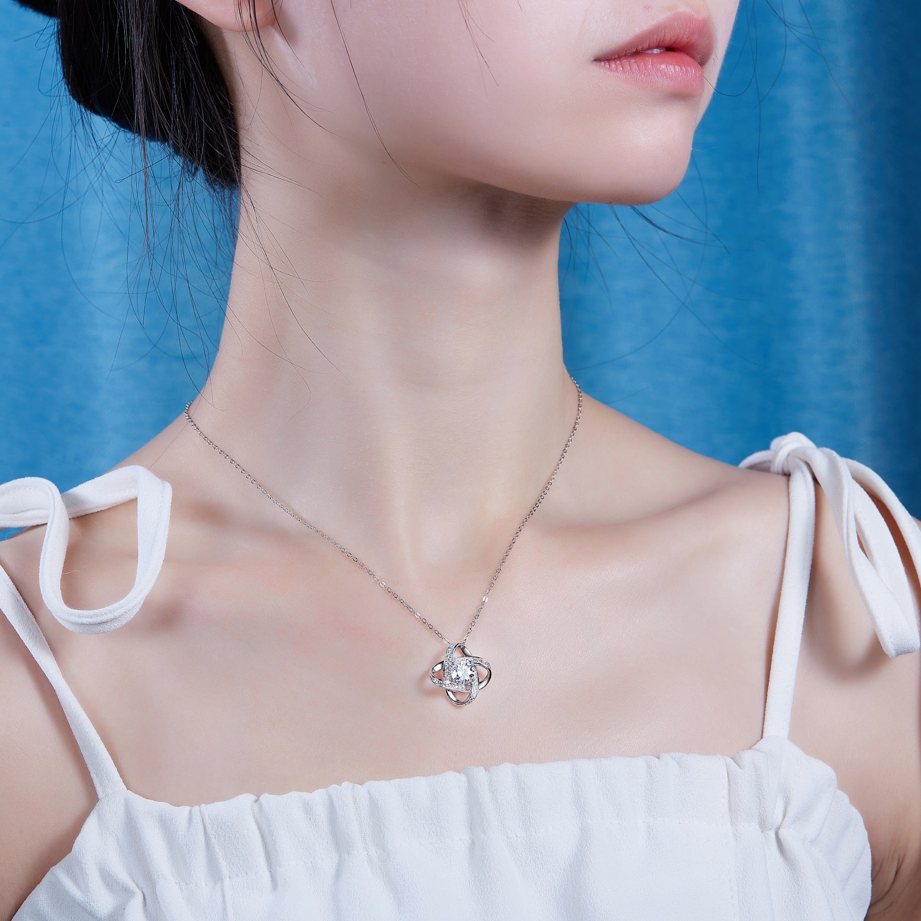 Entwined 1 Carat Moissanite Love Knot Pendant Necklace in Sterling Silver