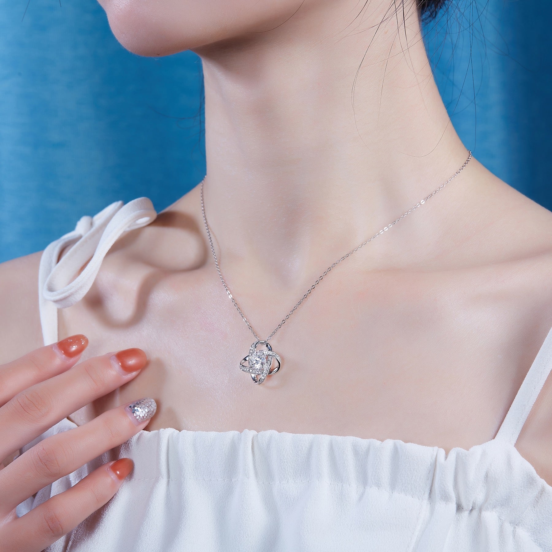 Entwined 1 Carat Moissanite Love Knot Pendant Necklace in Sterling Silver