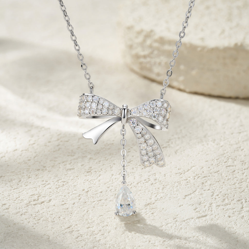 Belle Pear-Cut Moissanite Bow Pendant Necklace in Sterling Silver