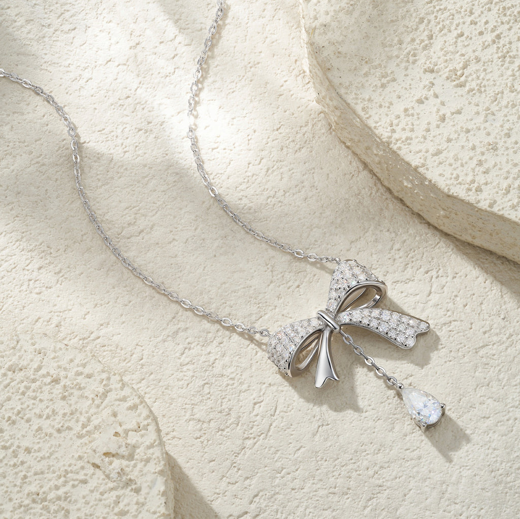 Belle Pear-Cut Moissanite Bow Pendant Necklace in Sterling Silver