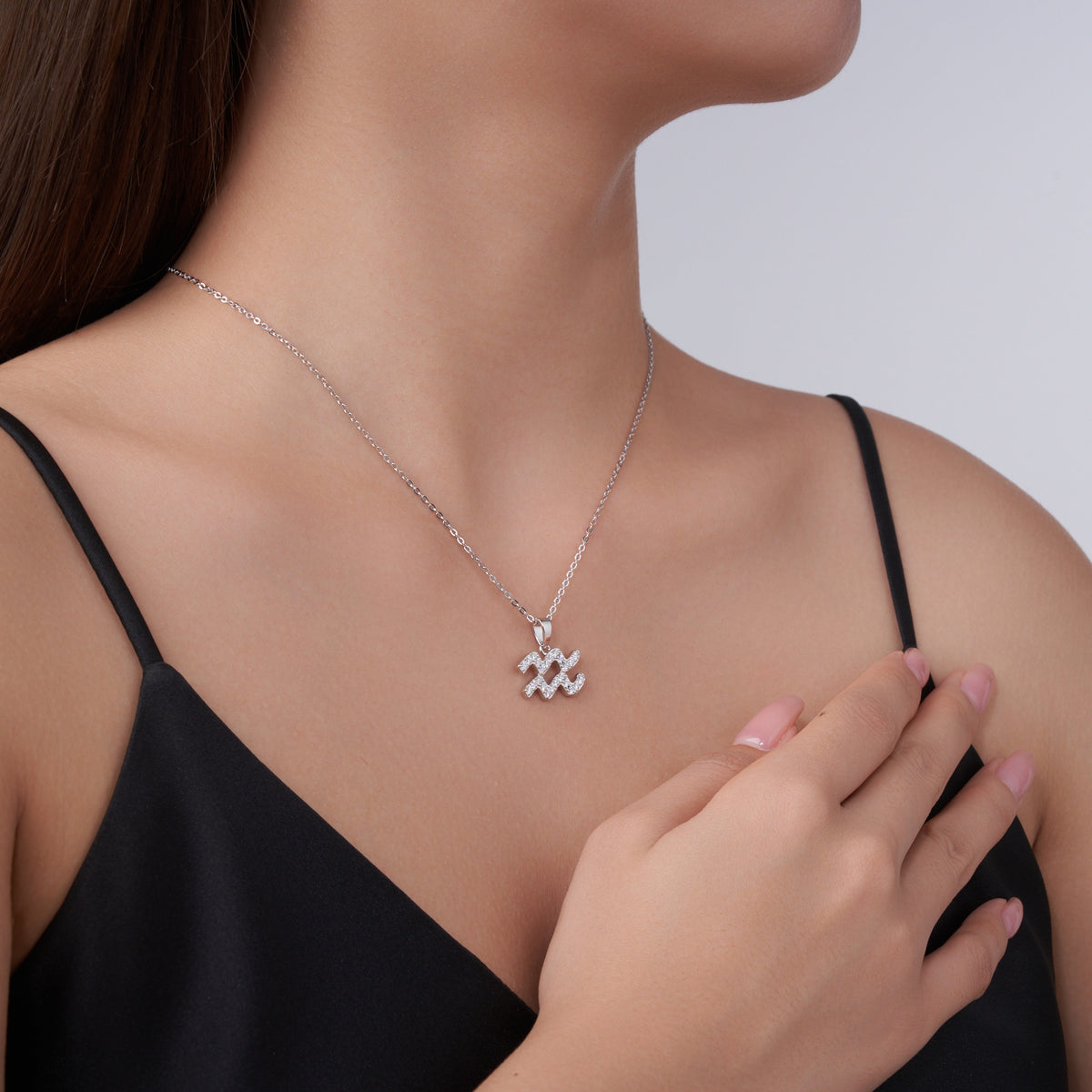 Aquarius Moissanite Zodiac Pendant Necklace in Sterling Silver, shown worn