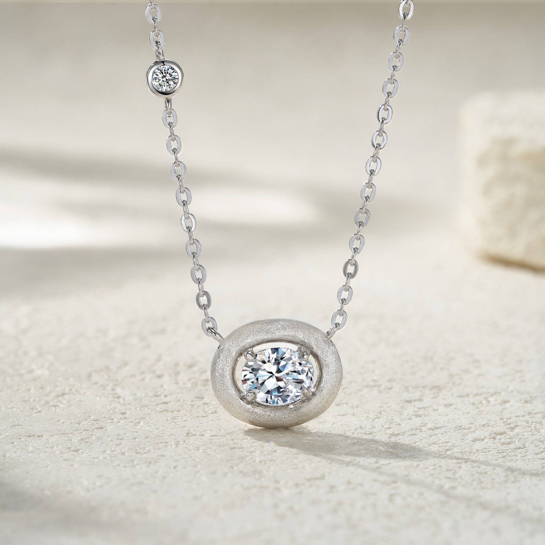 Pebble Moissanite Oval Bezel Necklace in Sterling Silver