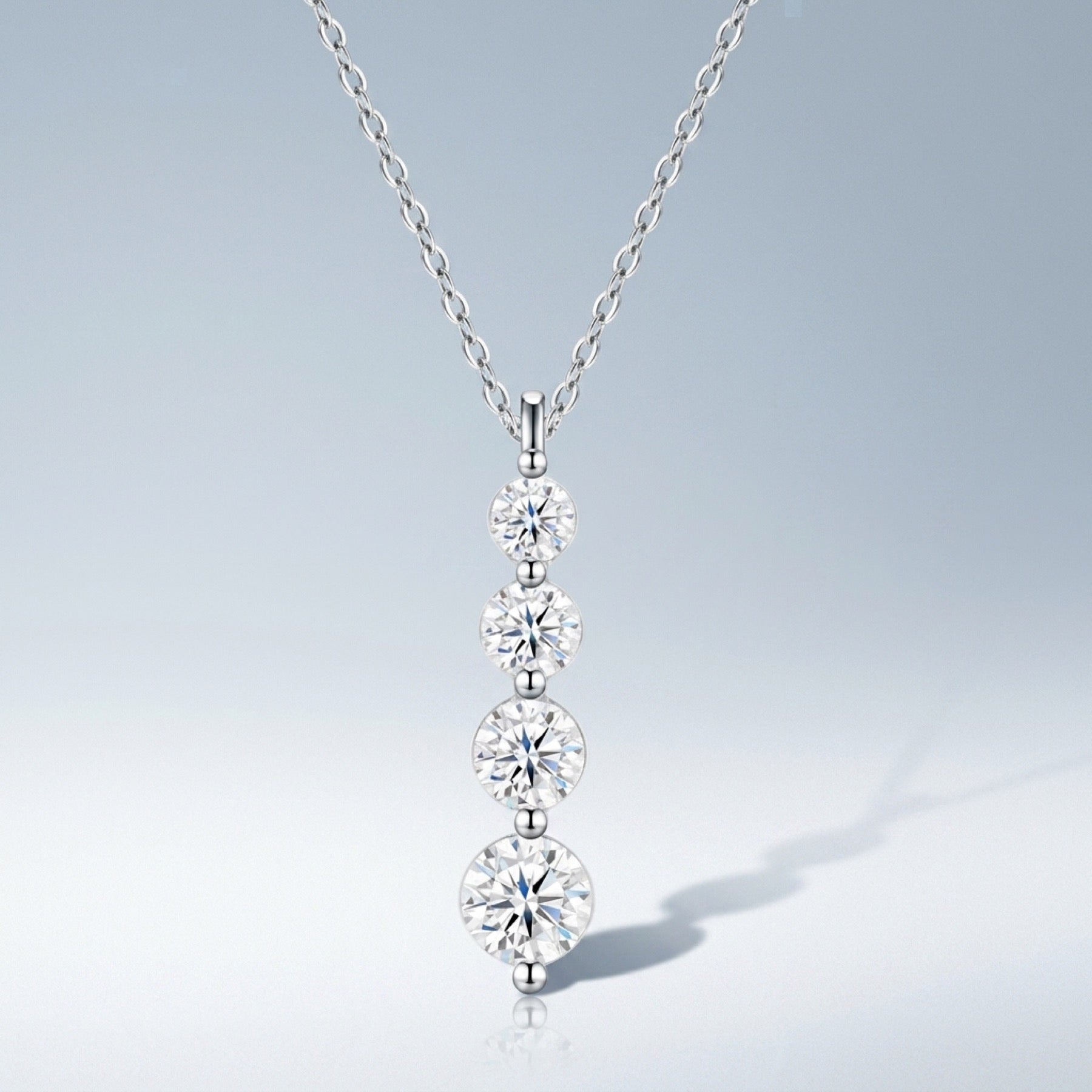 Descent Moissanite Three-Stone Drop Necklace in Sterling Silver