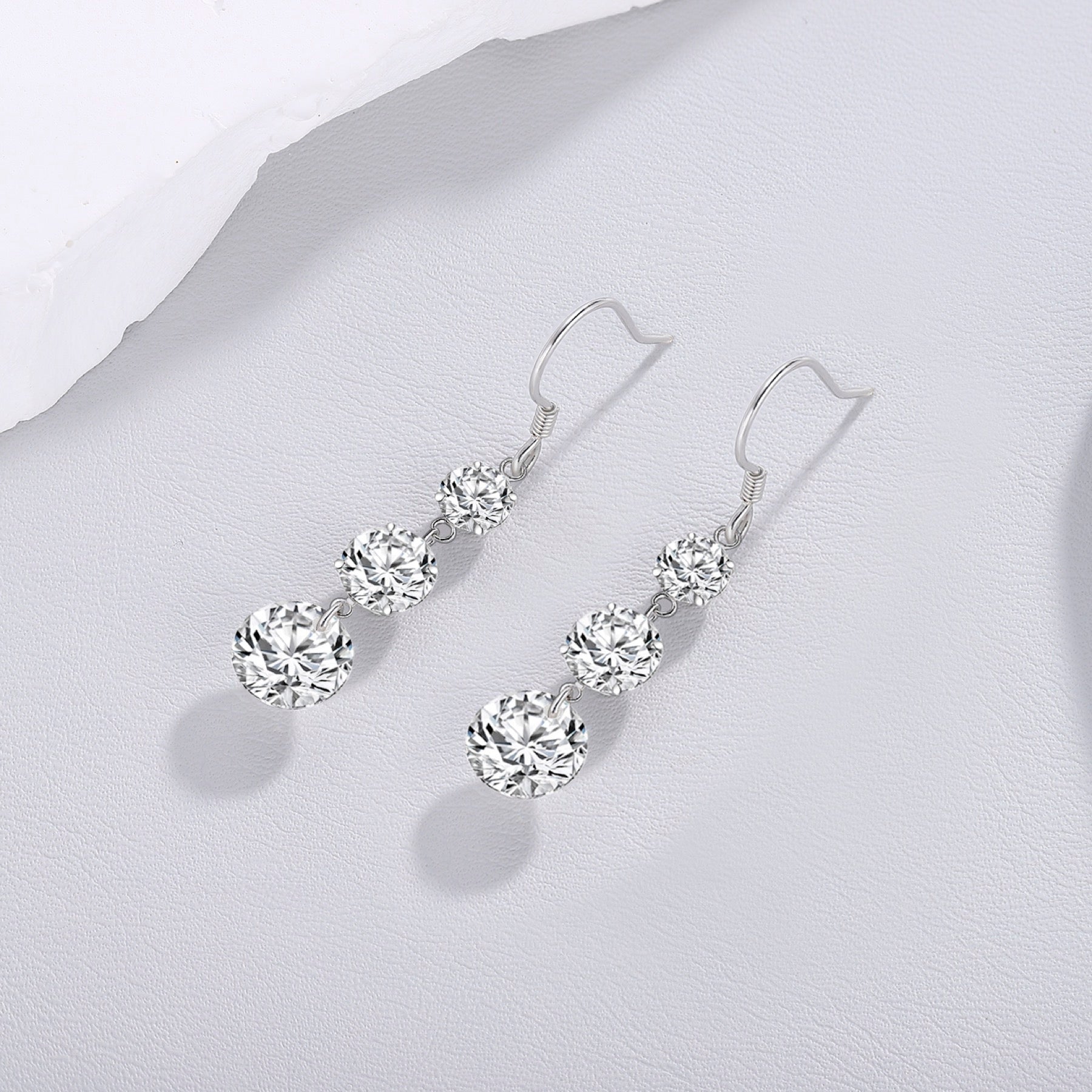 Tiered Moissanite Three-Stone Drop Earrings in Sterling Silver