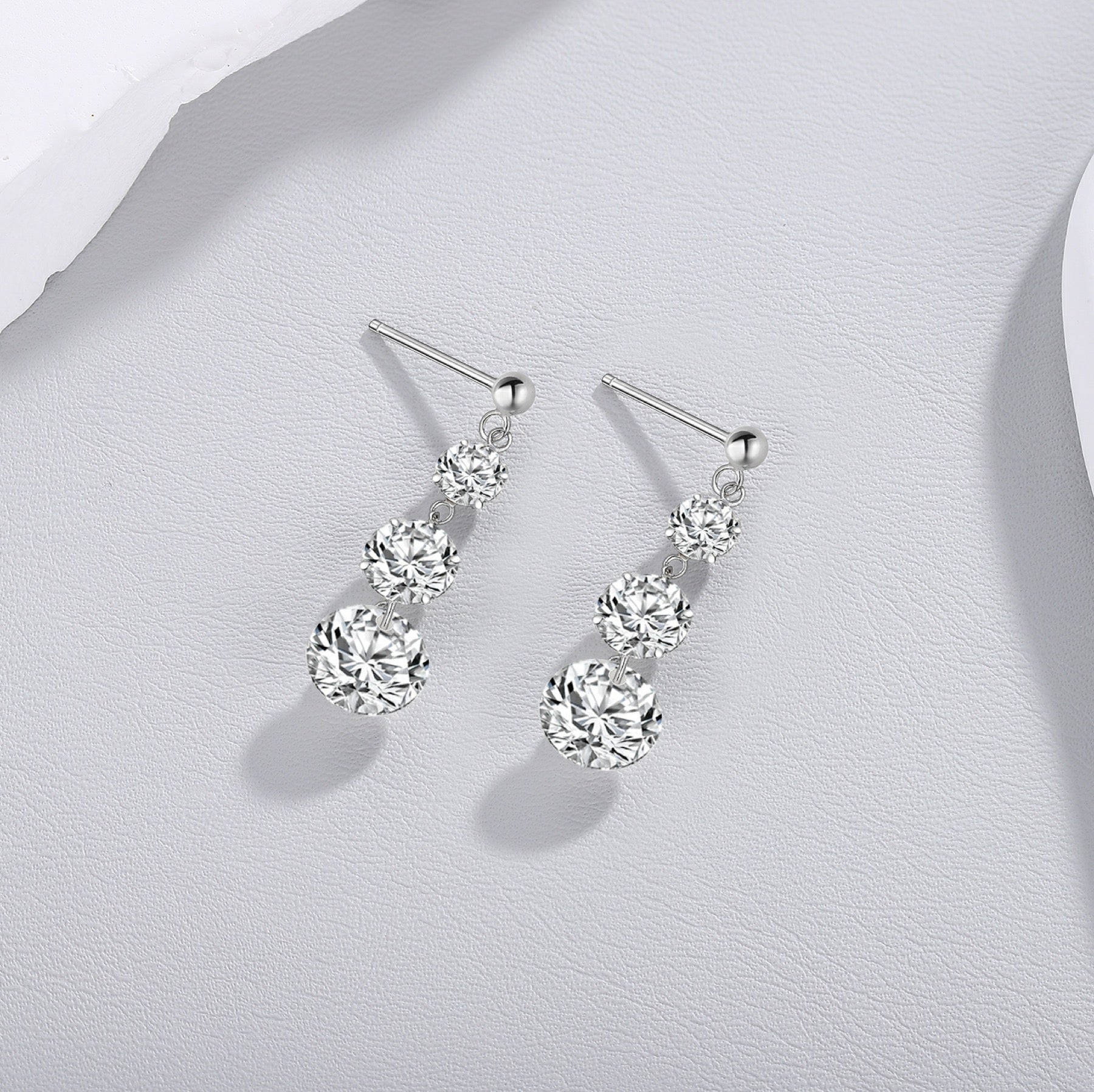 Stream Moissanite Three-Stone Drop Earrings in Sterling Silver
