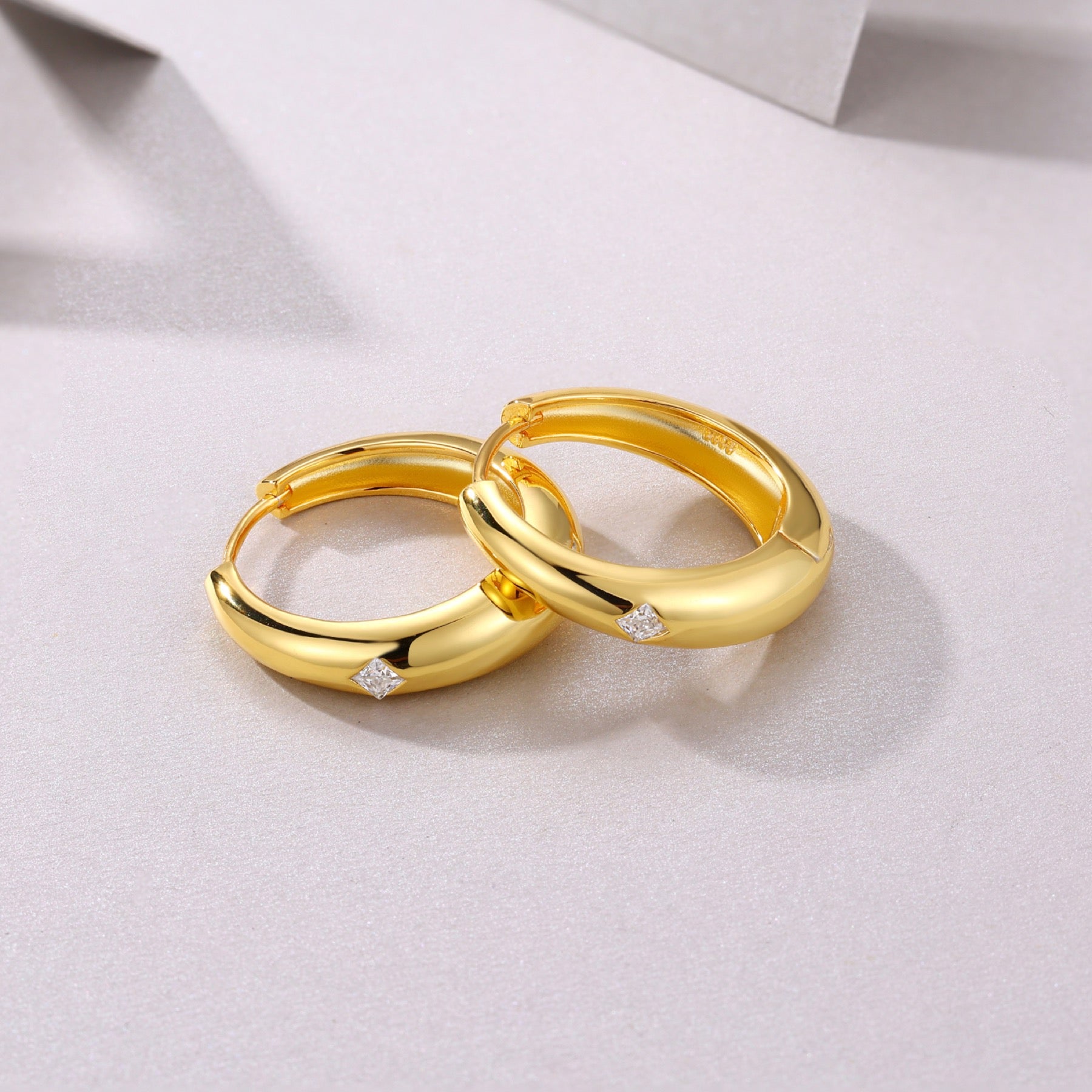 Stellare Moissanite Huggie Hoop Earrings in Gold-Tone Sterling Silver