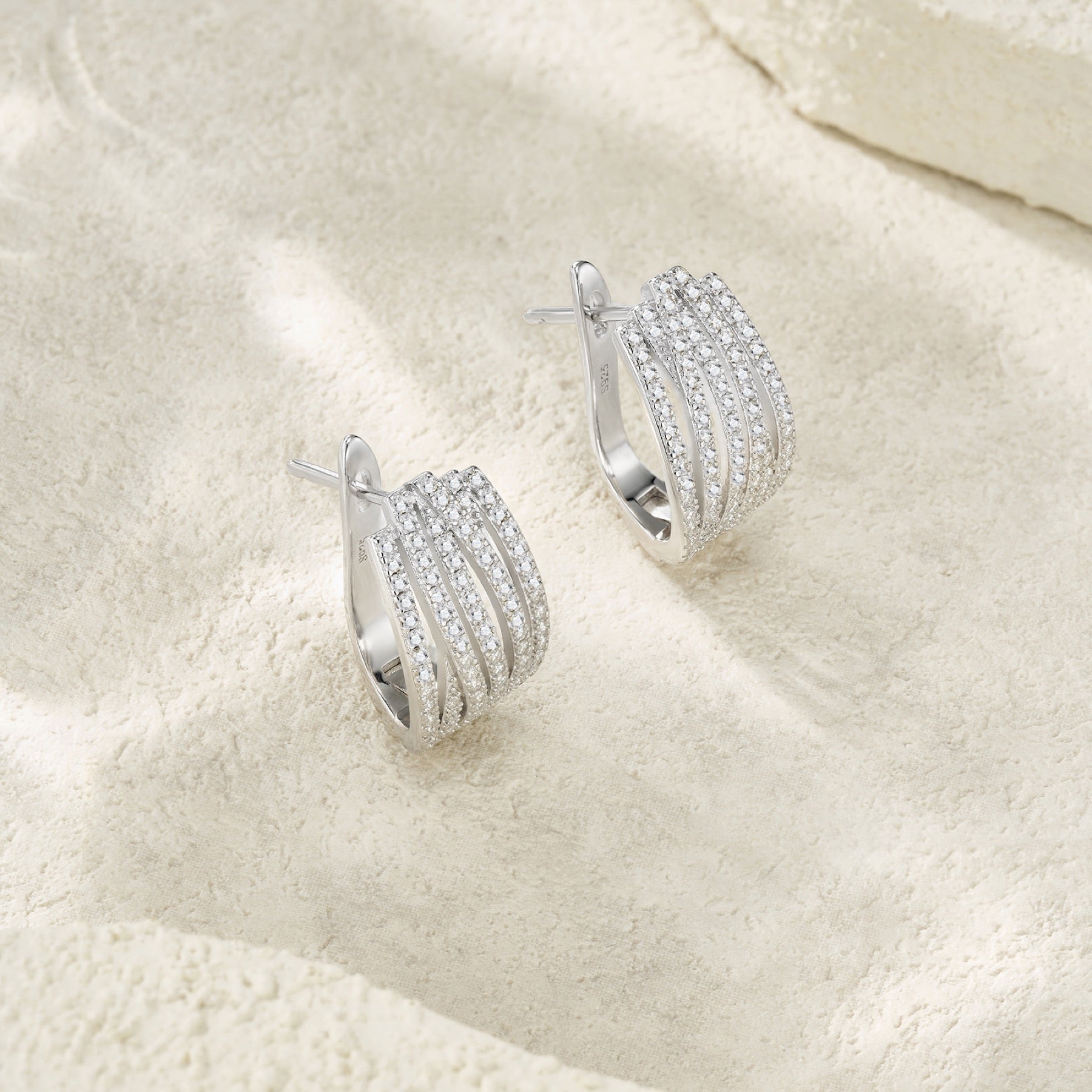Fascia Moissanite Huggie Hoop Earrings in Sterling Silver