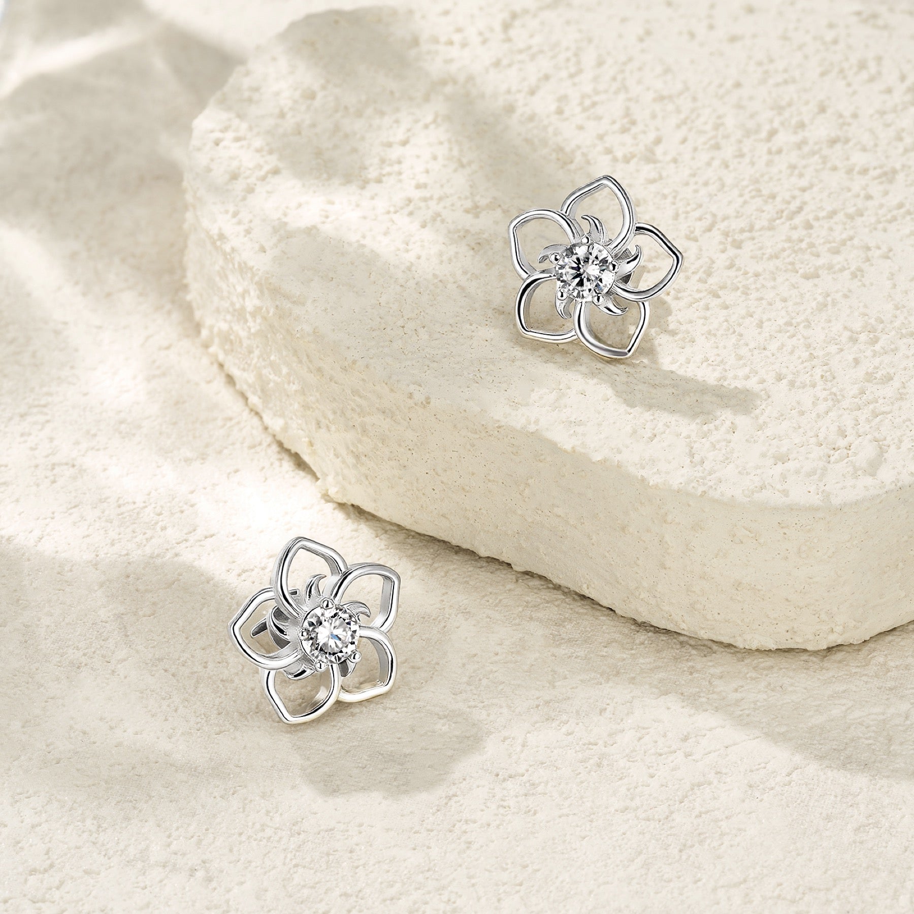 Plumeria Moissanite Flower Stud Earrings in Sterling Silver