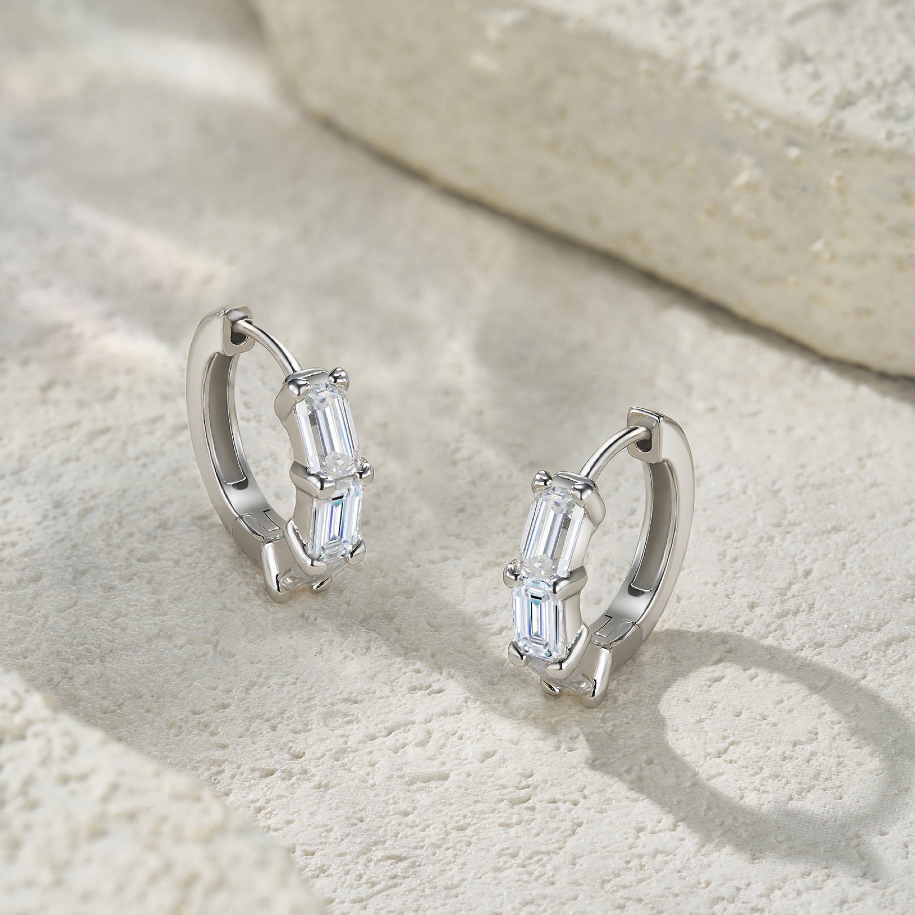Tris Moissanite Huggie Hoop Earrings in Sterling Silver