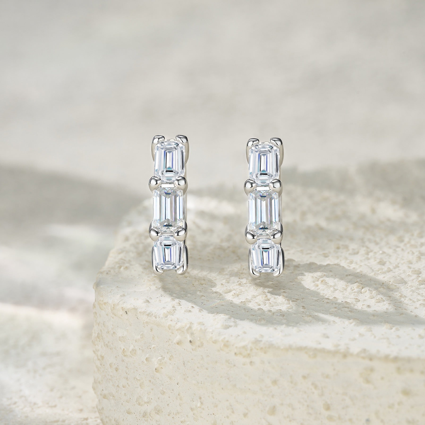 Tris Moissanite Huggie Hoop Earrings in Sterling Silver