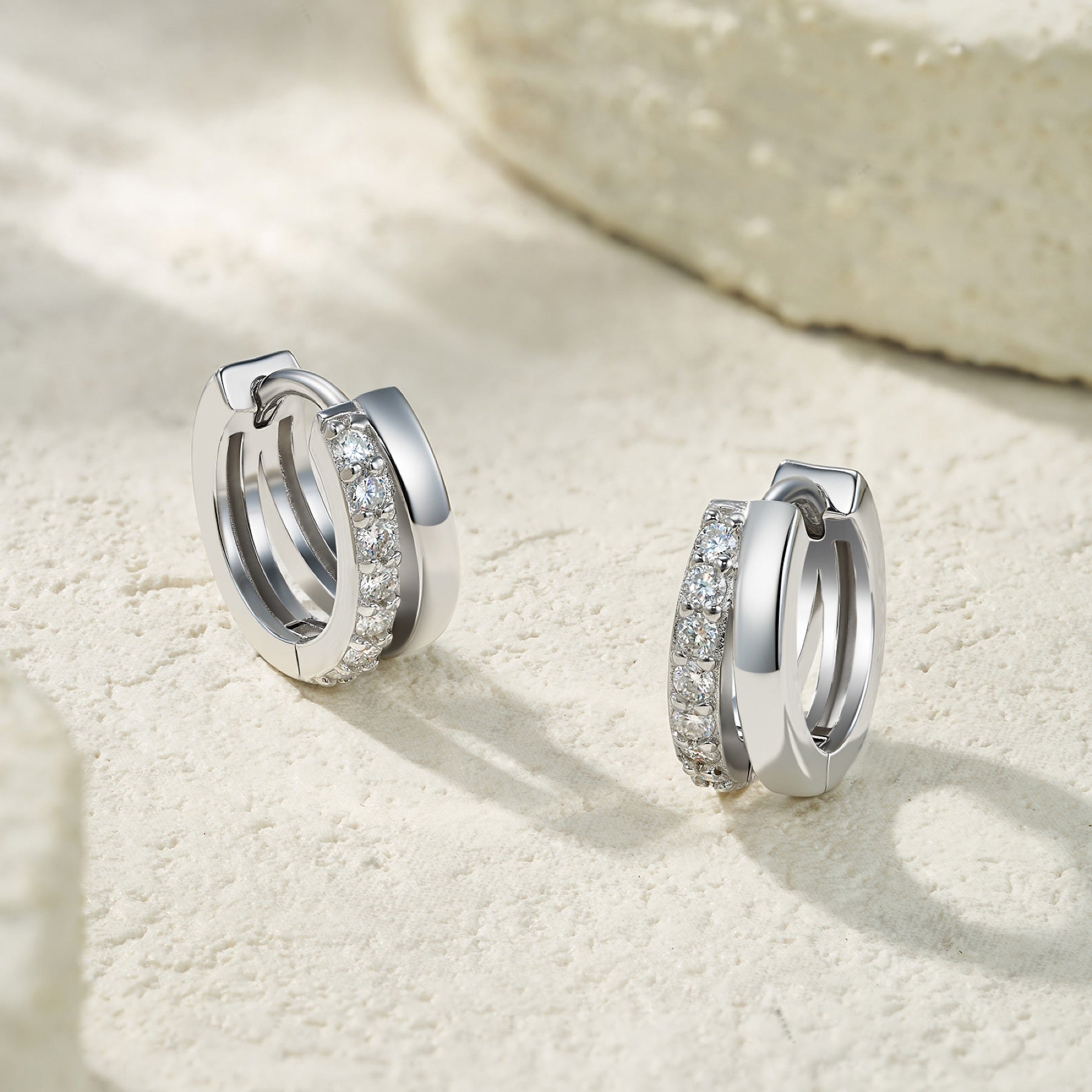 Larghezza Moissanite Huggie Hoop Earrings in Sterling Silver