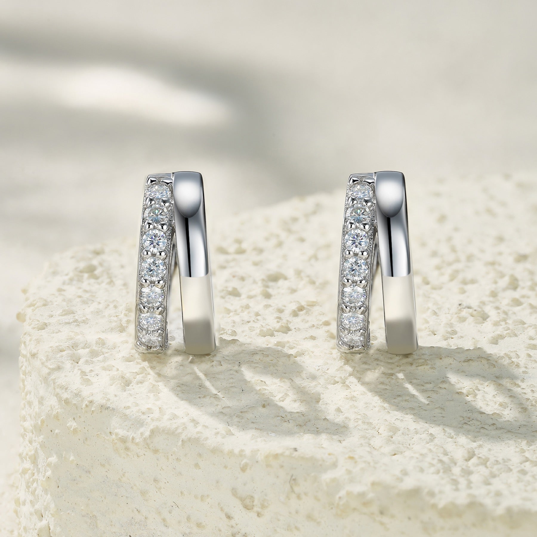 Larghezza Moissanite Huggie Hoop Earrings in Sterling Silver