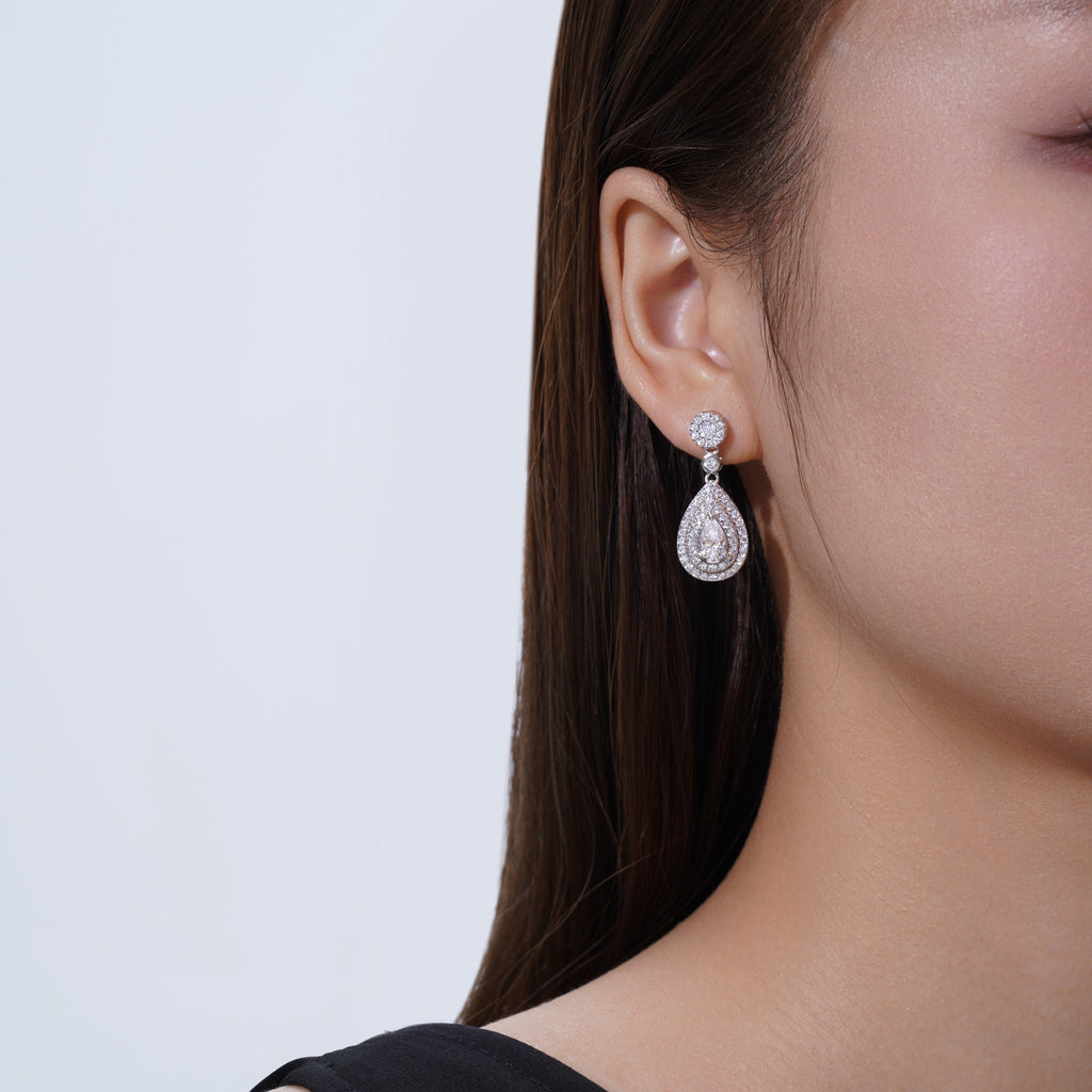 Duegocce Pear-Cut Moissanite Drop Stud Earrings in Sterling Silver