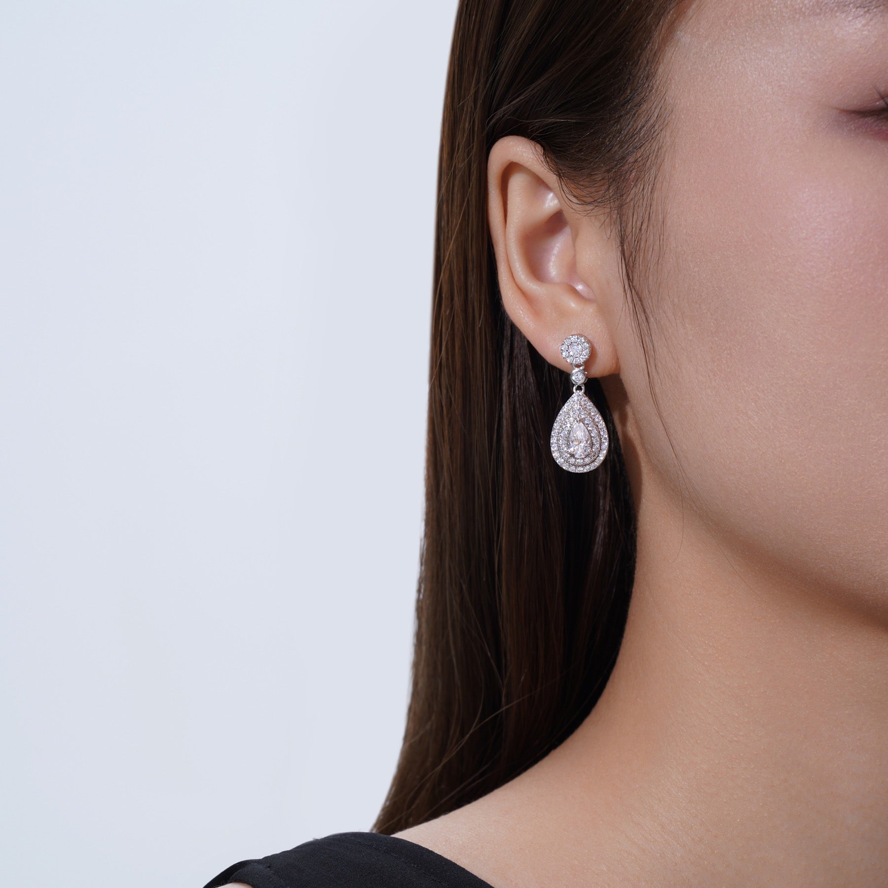 Duegocce Pear-Cut Moissanite Drop Stud Earrings in Sterling Silver