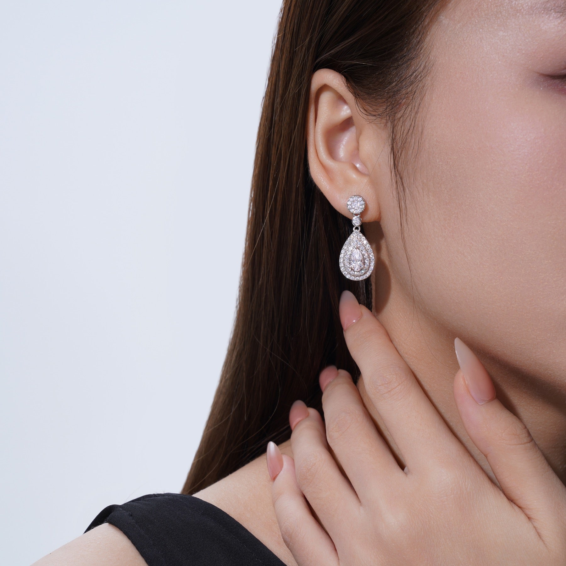 Duegocce Pear-Cut Moissanite Drop Stud Earrings in Sterling Silver