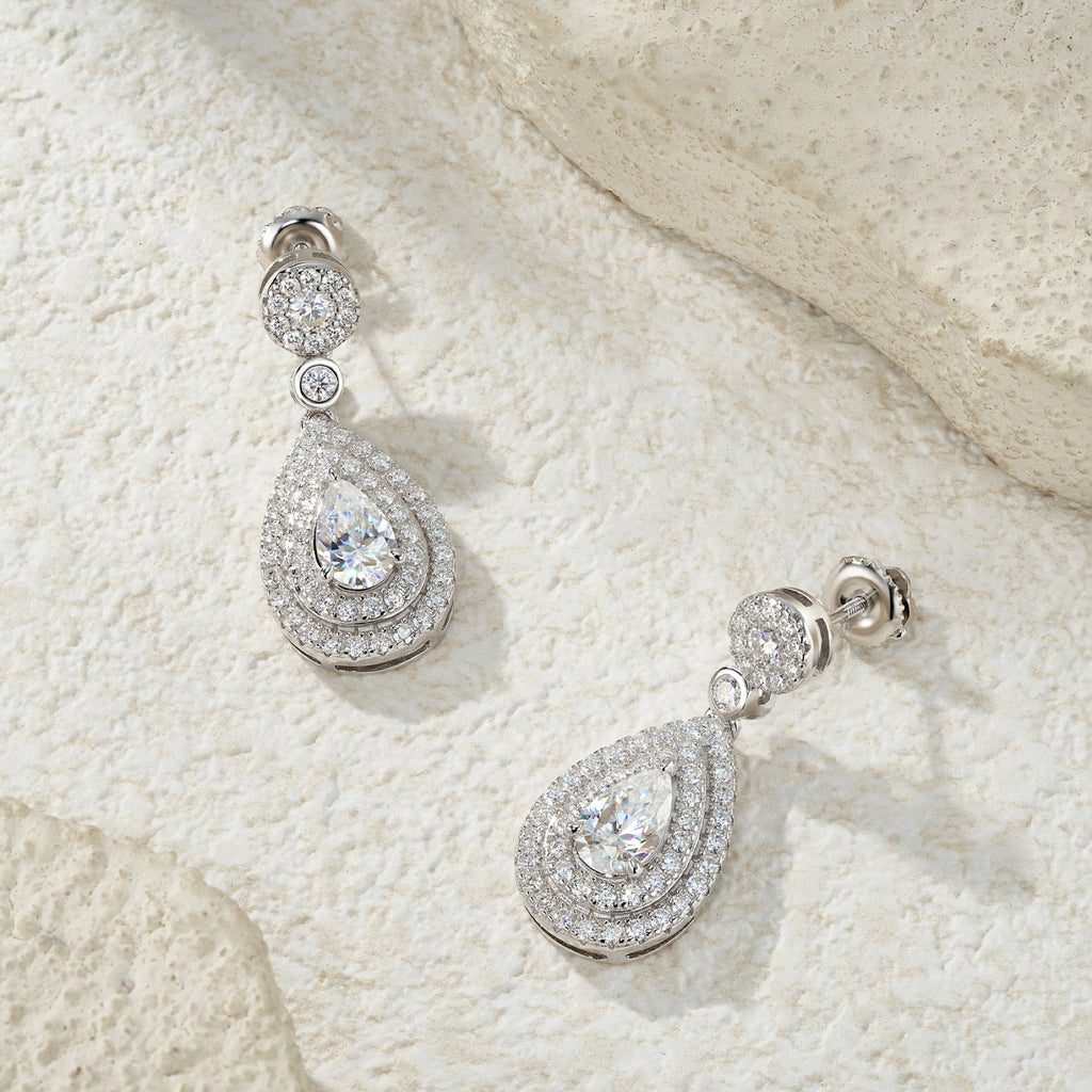 Duegocce Pear-Cut Moissanite Drop Stud Earrings in Sterling Silver