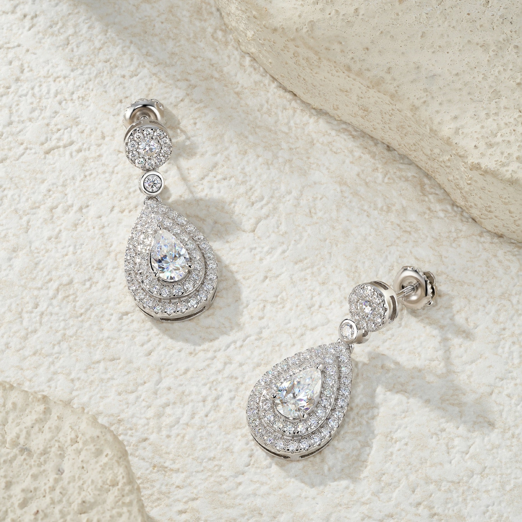 Duegocce Pear-Cut Moissanite Drop Stud Earrings in Sterling Silver