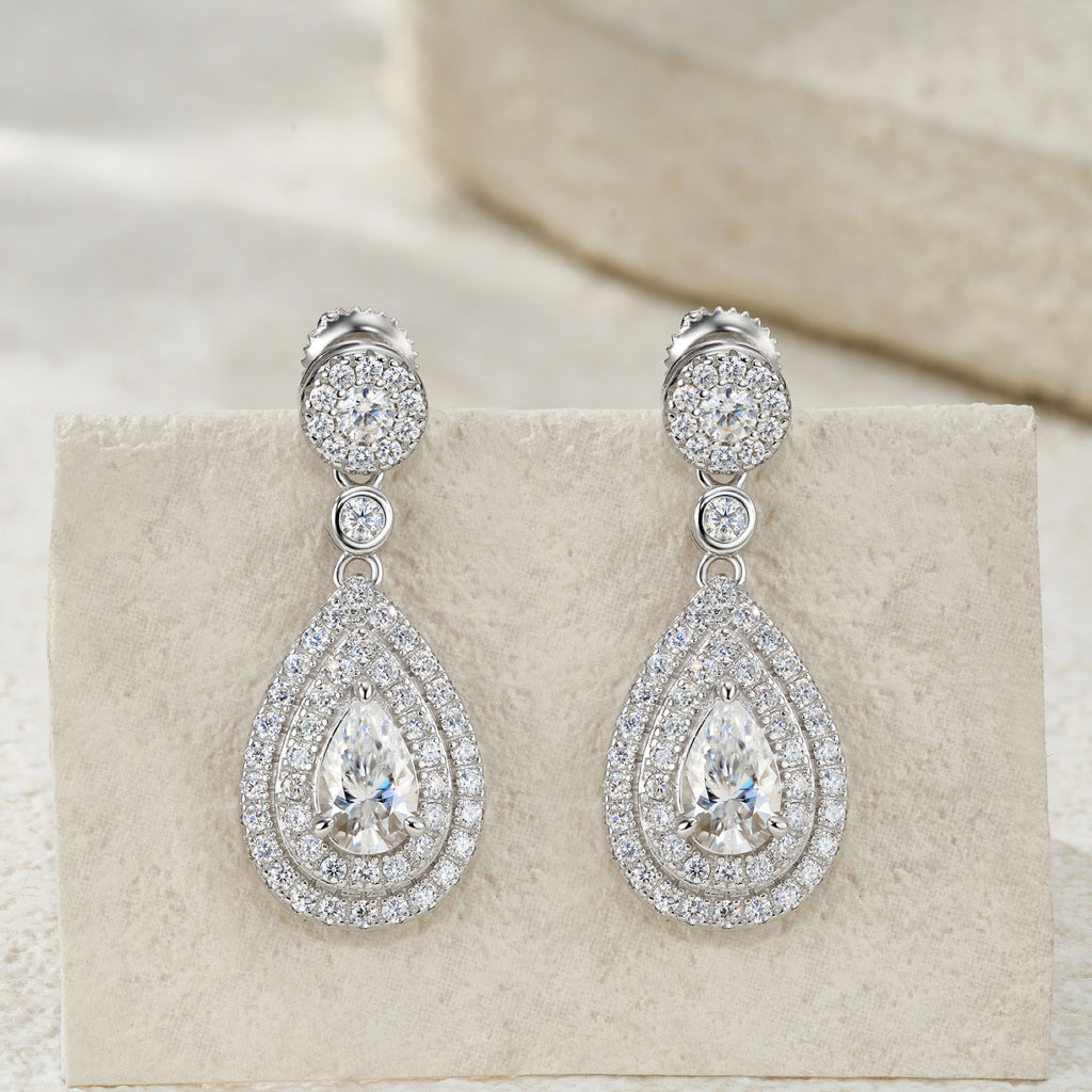 Duegocce Pear-Cut Moissanite Drop Stud Earrings in Sterling Silver