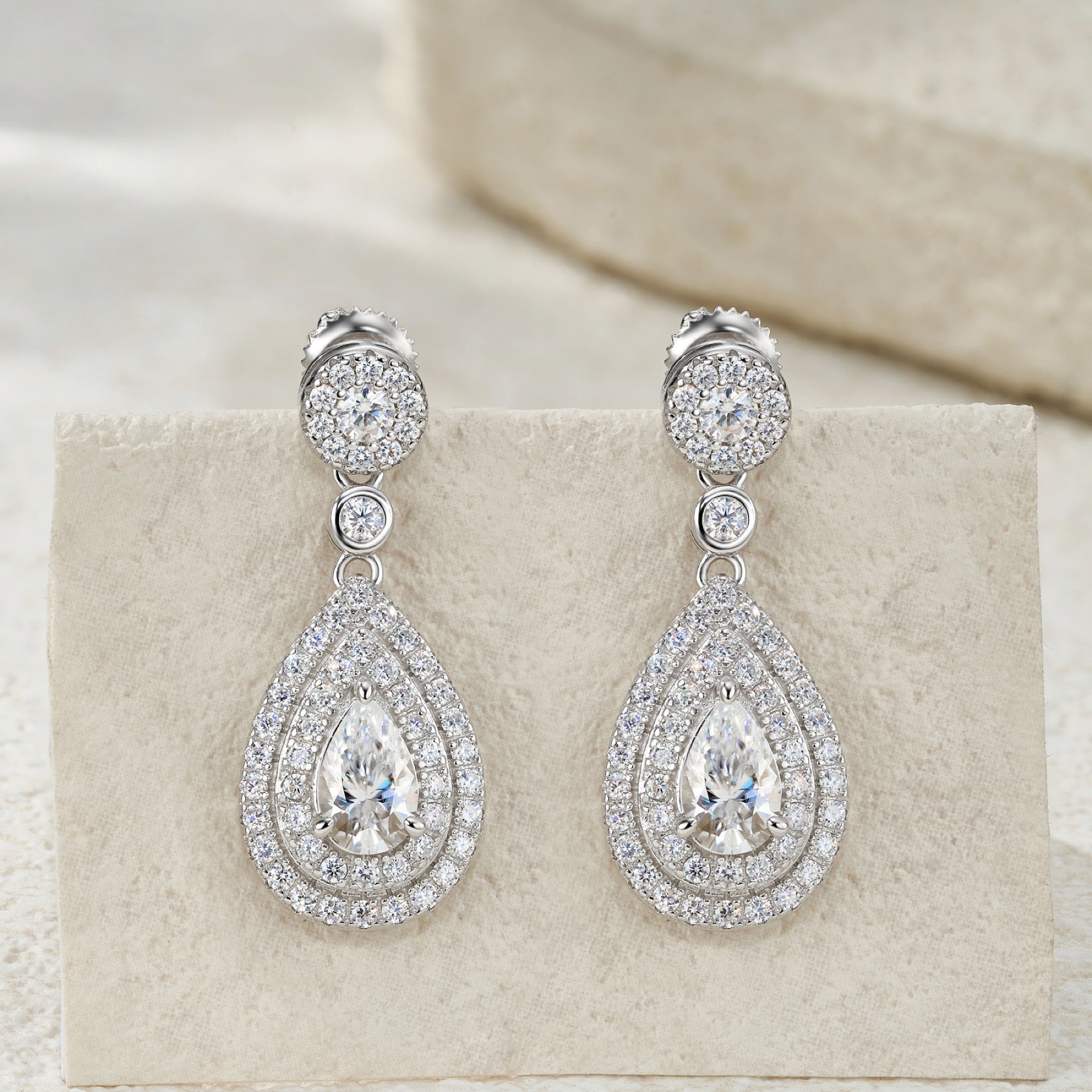 Duegocce Pear-Cut Moissanite Drop Stud Earrings in Sterling Silver