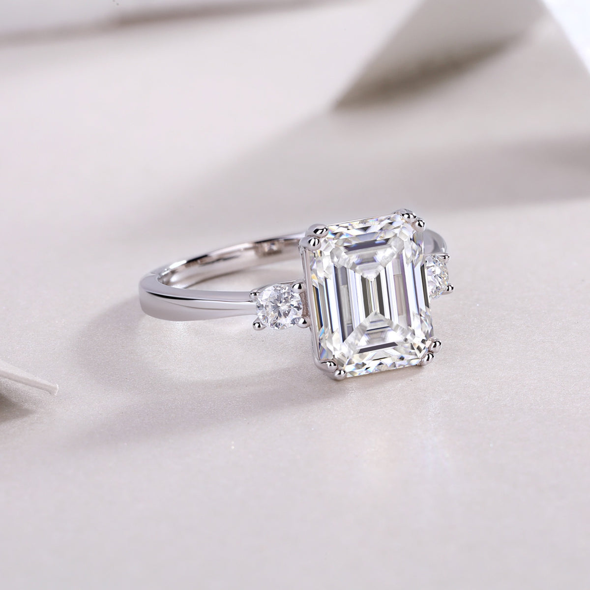 Token 4 Carat Emerald-Cut Moissanite Three-Stone Ring in Sterling Silver