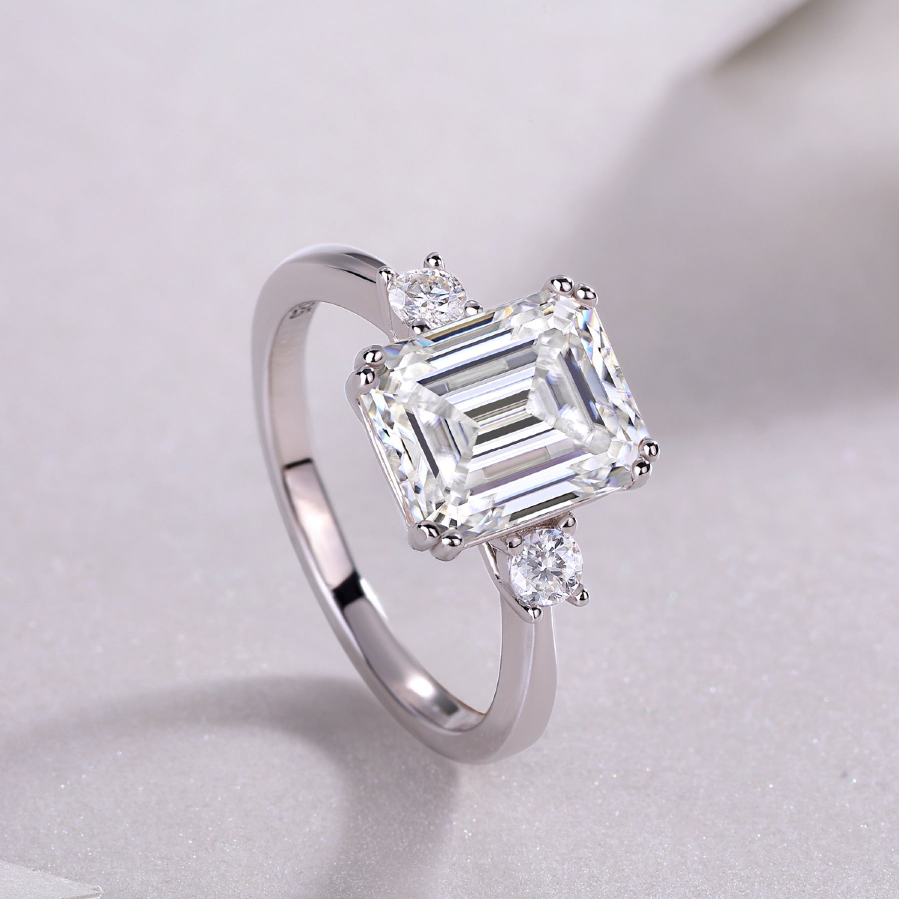 Token Emerald-Cut Moissanite Three-Stone Ring in Sterling Silver