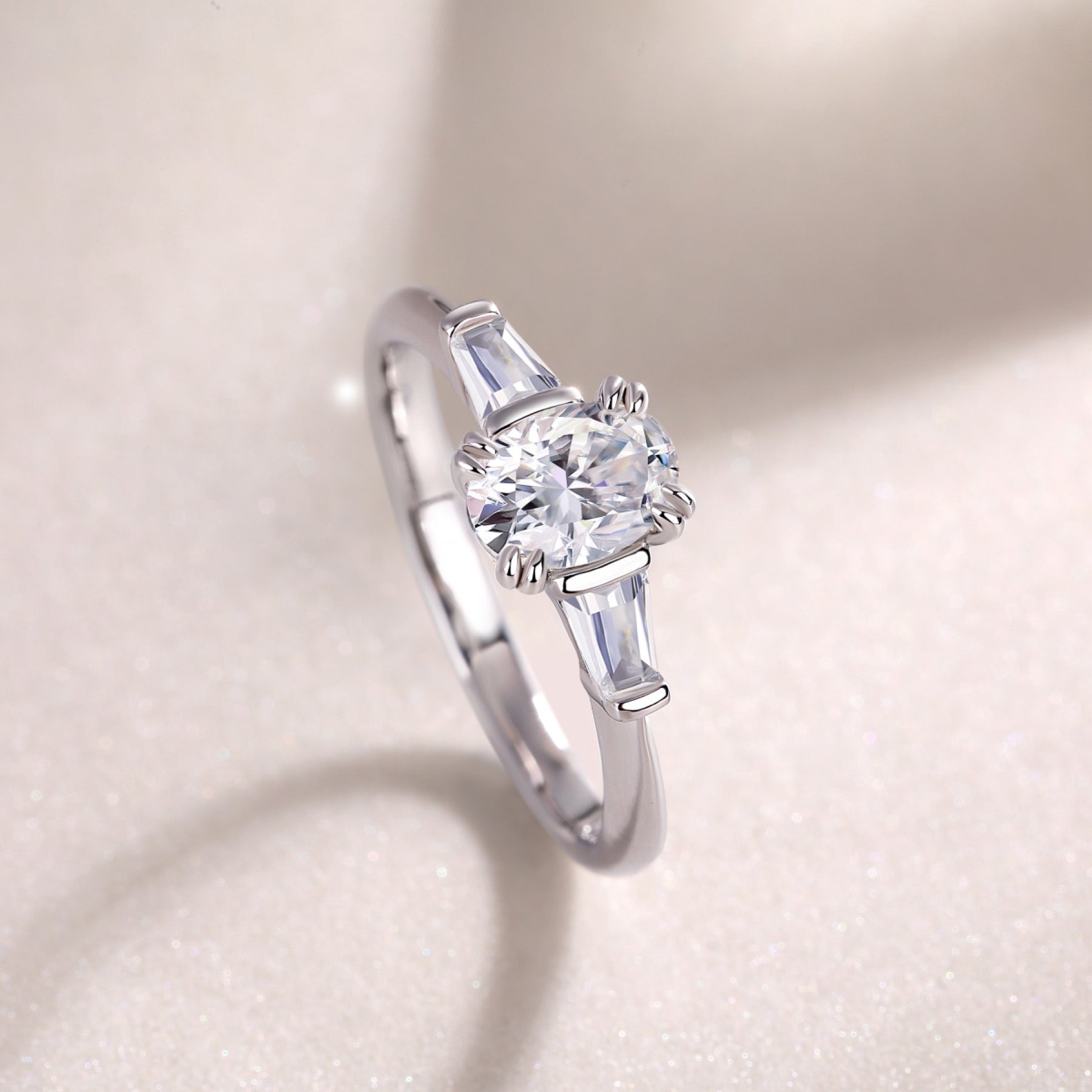 Descend Oval-Cut Moissanite Three-Stone Ring in Sterling Silver