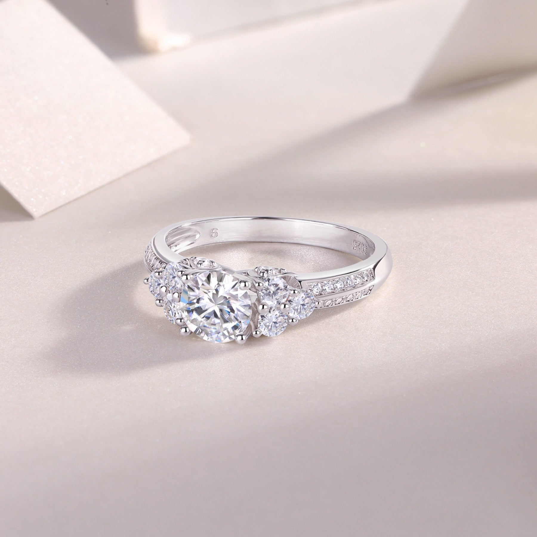 Coral Moissanite Three-Stone Ring in Sterling Silver
