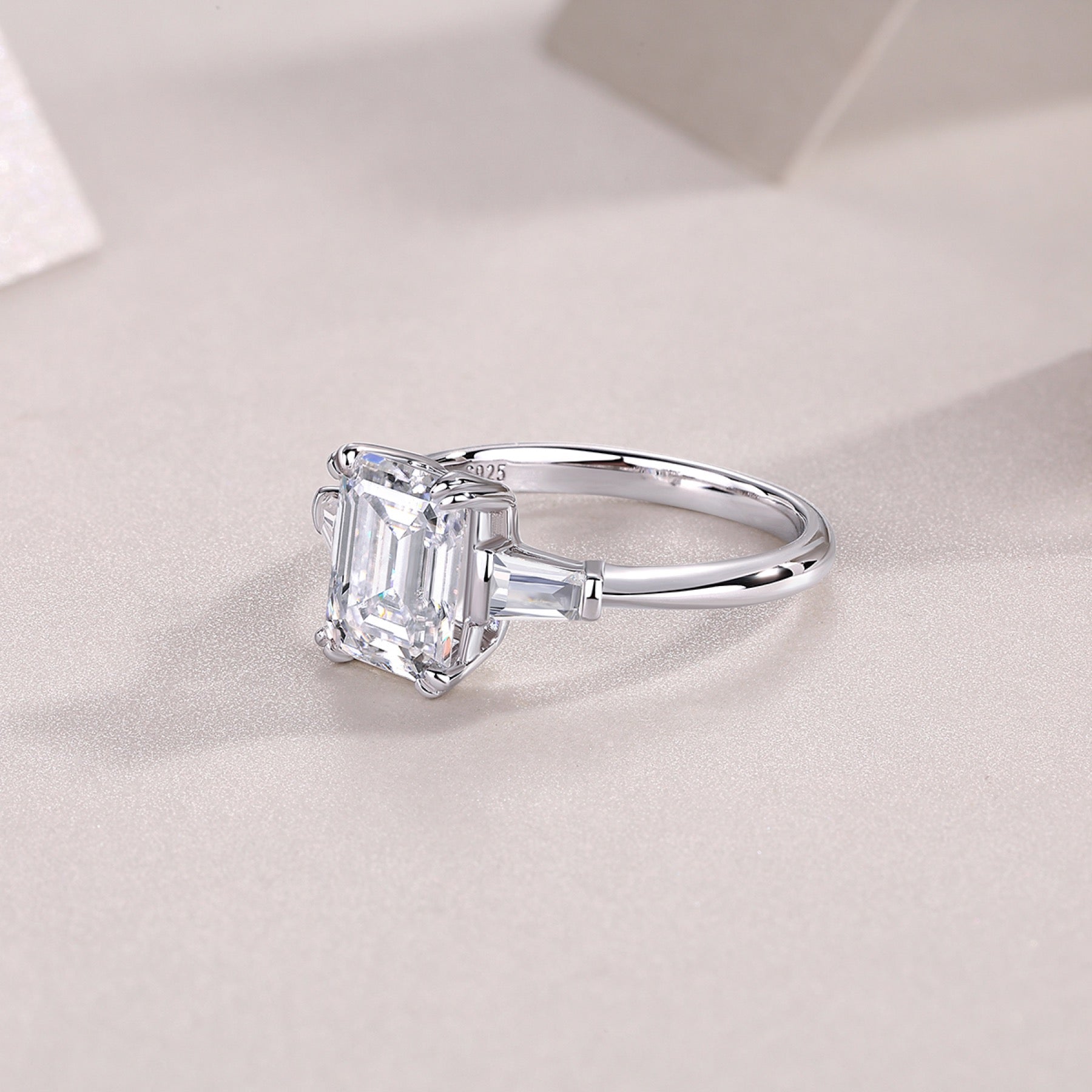 Reflekt Emerald-Cut Moissanite Three-Stone Ring in Sterling Silver