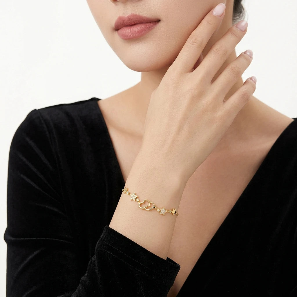 Cielo Moissanite Heart and Star Bracelet in Gold-Tone Sterling Silver, shown worn