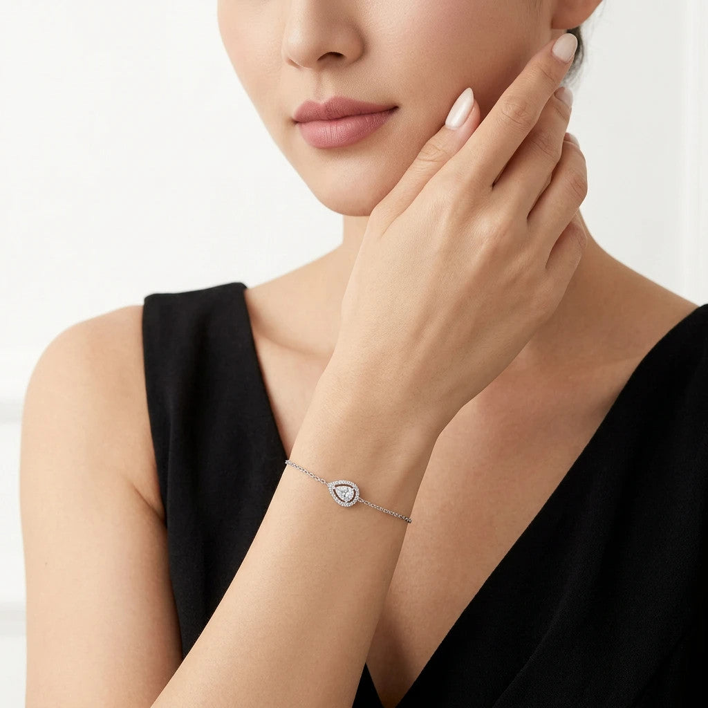 Brina Pear-Cut Moissanite Halo Chain Bracelet in Sterling Silver, shown worn
