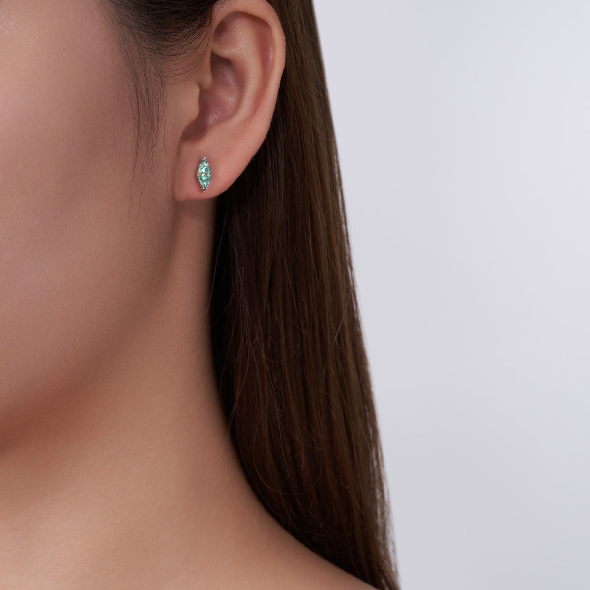 Baia Marquise-Cut Teal Moissanite Stud Earrings in Sterling Silver, shown worn
