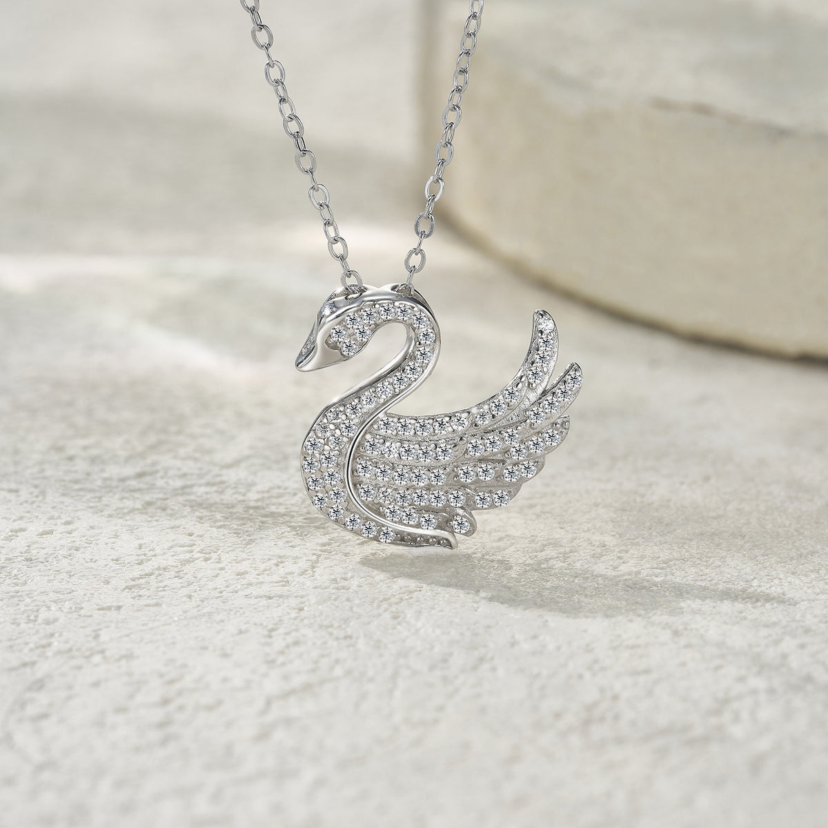Glissade Moissanite Pavé Swan Pendant Necklace in Sterling Silver, styled product photo