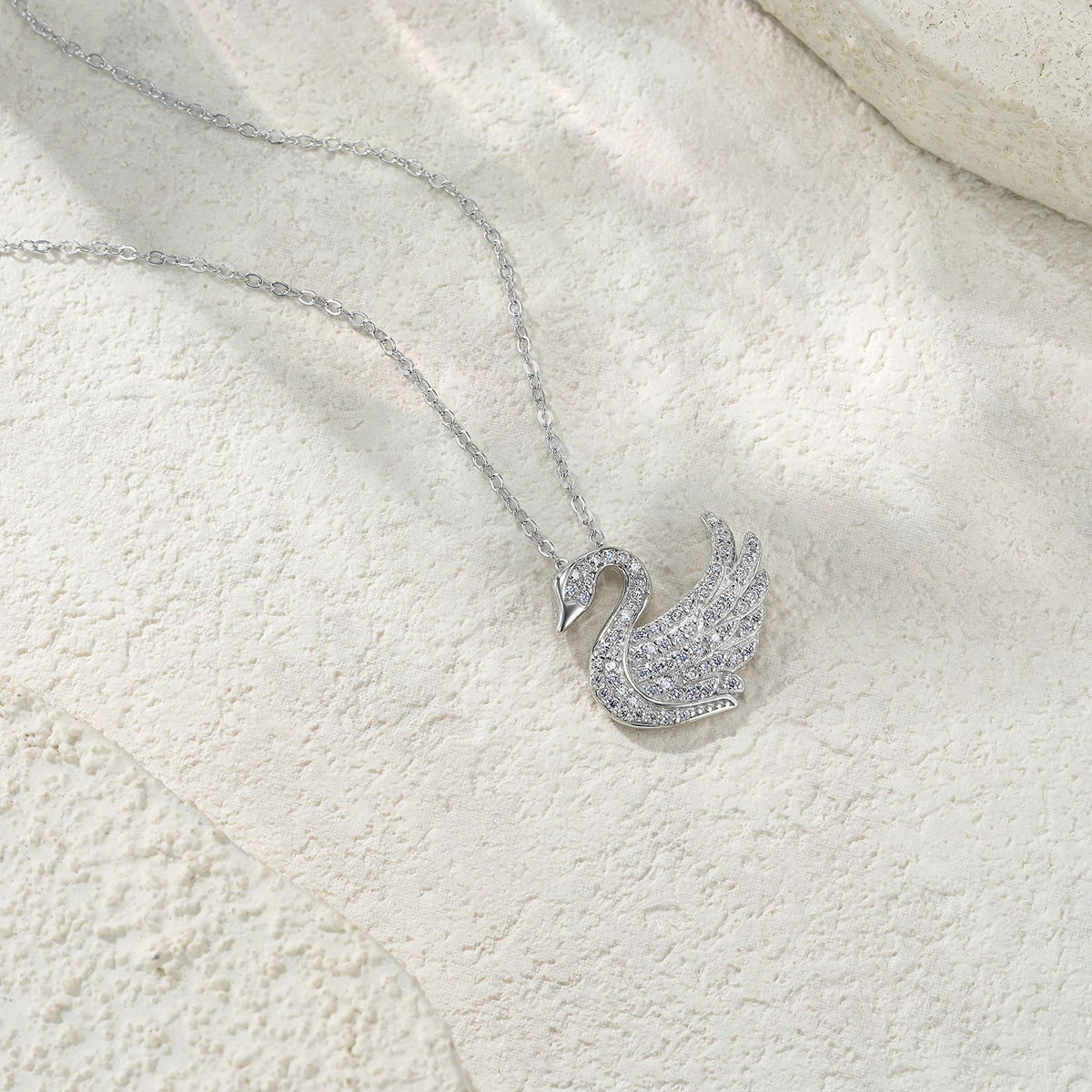 Glissade Moissanite Pavé Swan Pendant Necklace in Sterling Silver, styled product photo