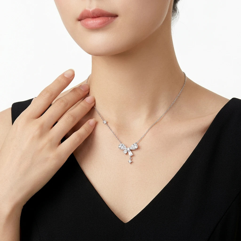 Galante Moissanite Bow Pendant Necklace in Sterling Silver, shown worn