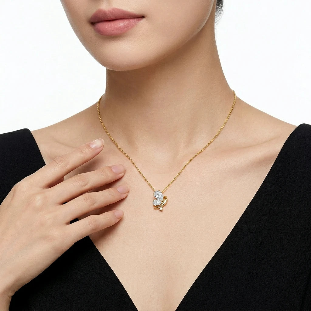 Ginestra Moissanite Pear Pendant Necklace in Gold-Tone Sterling Silver, shown worn