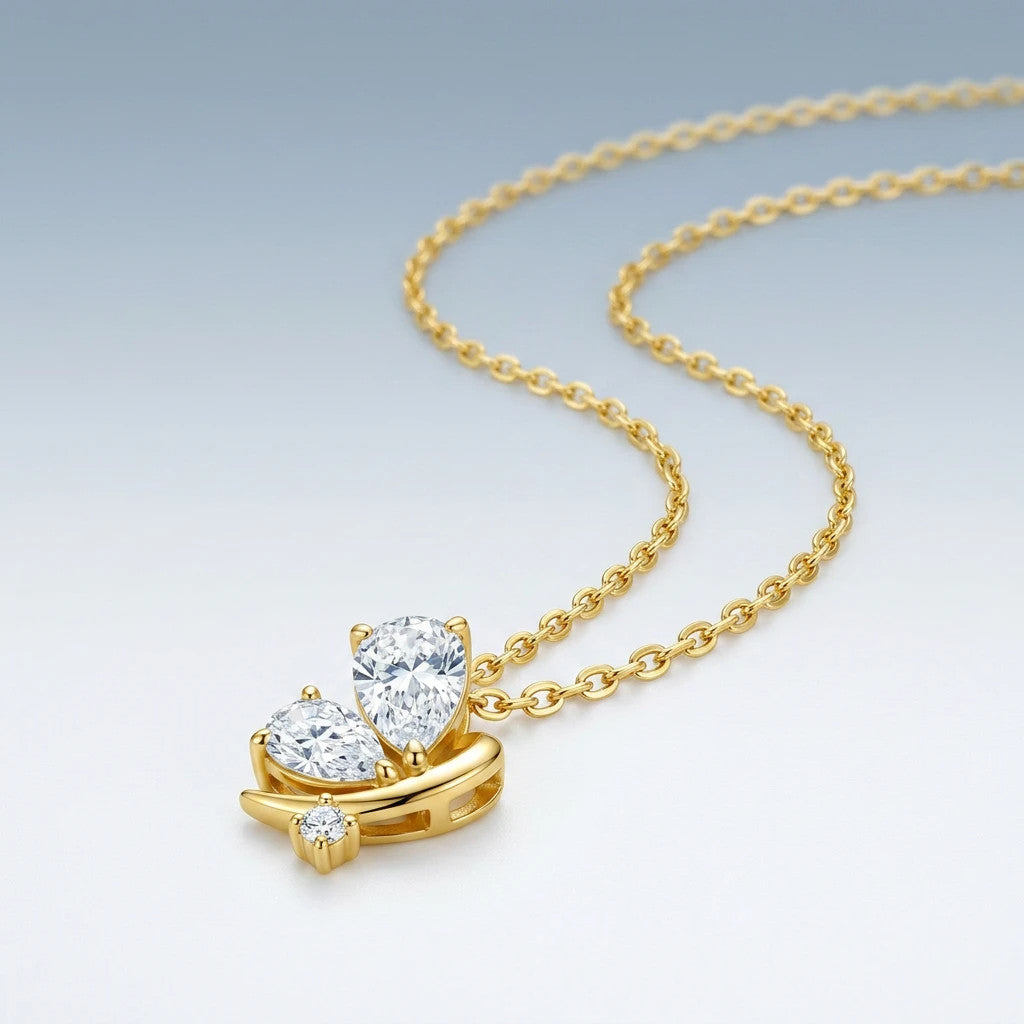 Ginestra Moissanite Pear Pendant Necklace in Gold-Tone Sterling Silver, styled product photo