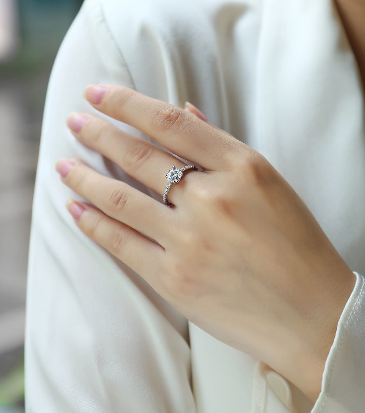 Kindred Round Moissanite Solitaire Engagement Ring in Sterling Silver, shown worn