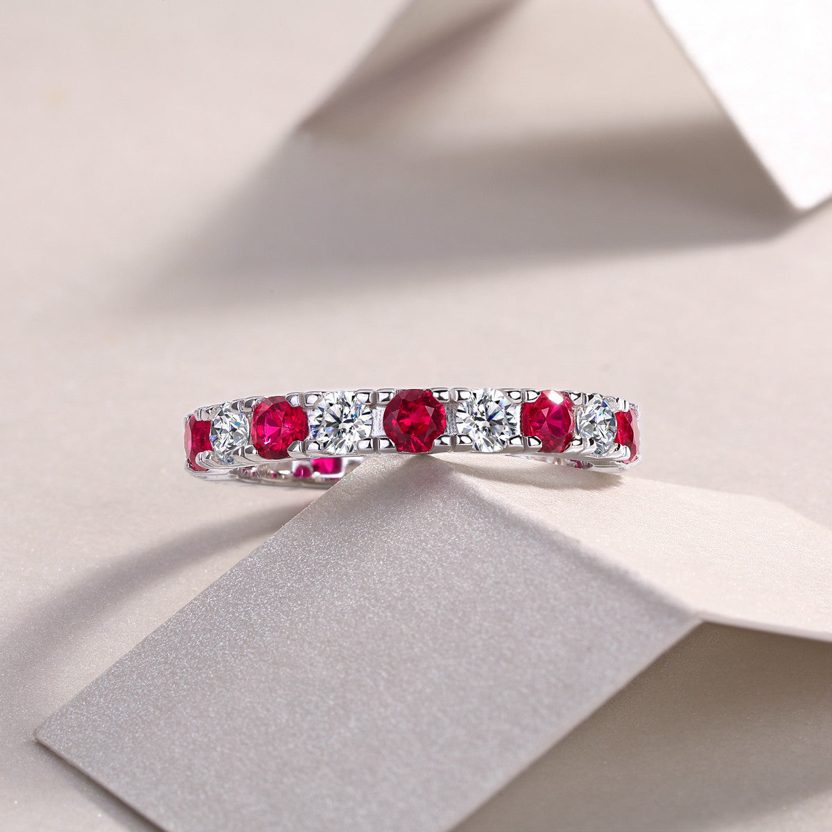 Marasca Lab-Created Ruby Eternity Band Ring in Sterling Silver, styled product photo