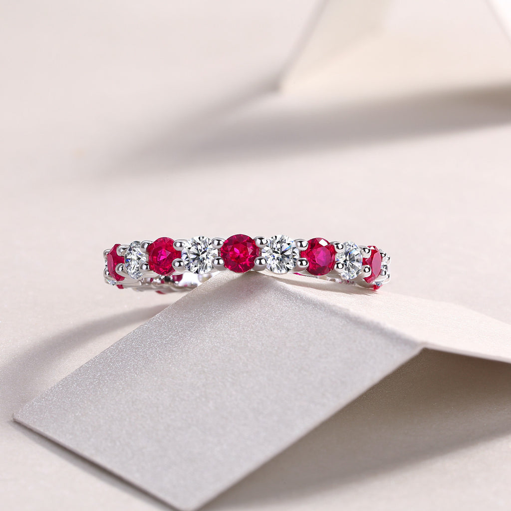 Madrigale Lab-Created Ruby Eternity Band Ring in Sterling Silver, styled product photo