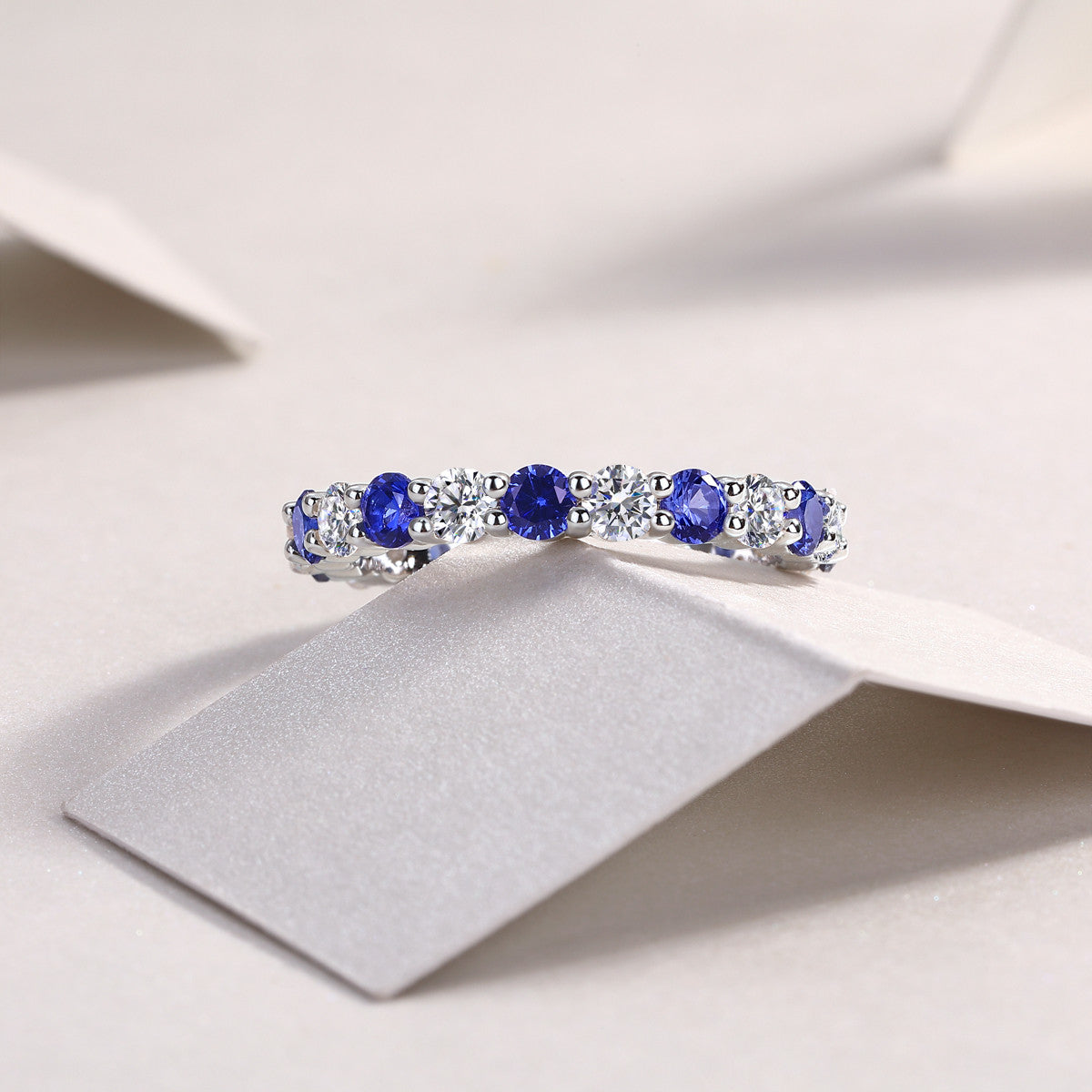Mezzanotte Lab-Created Sapphire Eternity Band Ring in Sterling Silver, styled product photo