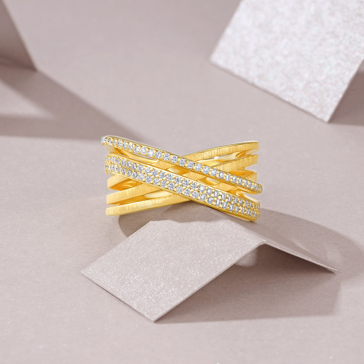 Matassa Moissanite Crisscross Band Ring in Gold-Tone Sterling Silver, styled product photo
