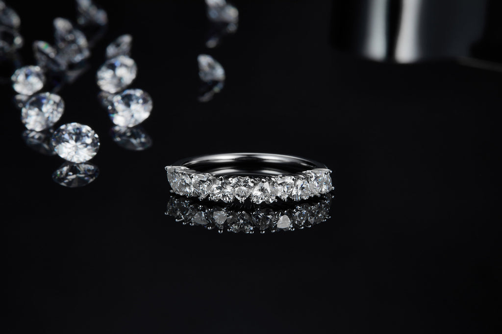 Millecuori Heart-Cut Moissanite Half Eternity Ring in Sterling Silver, styled product photo